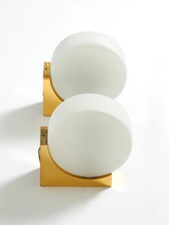 Pair of 60s wall lamps made of brass and round glass shades by Kaiser Leuchten