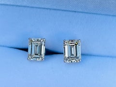 Pair of 6.10 Carat VS Clarity Emerald Cut Diamond Solitaire Stud Earrings