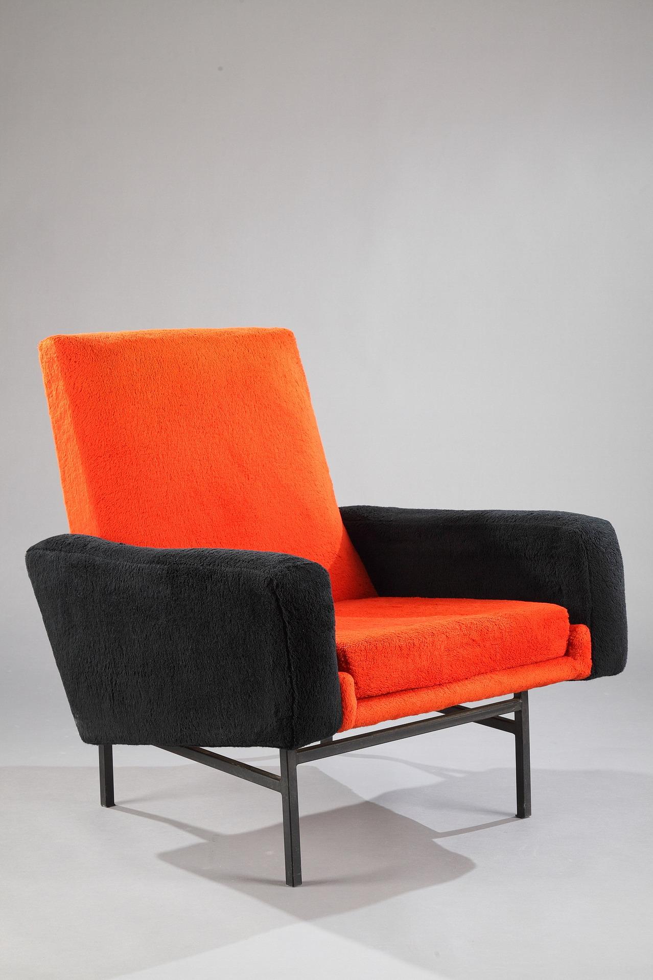 A pair of 642 A.R.P. (Research Plastic Studio, a group composed of three designers: Motte, Mortier & Guariche) armchairs edited by Steiner during the 1950s. Black lacquered metal feet and structure covered with a black and orange wollen upholstery.