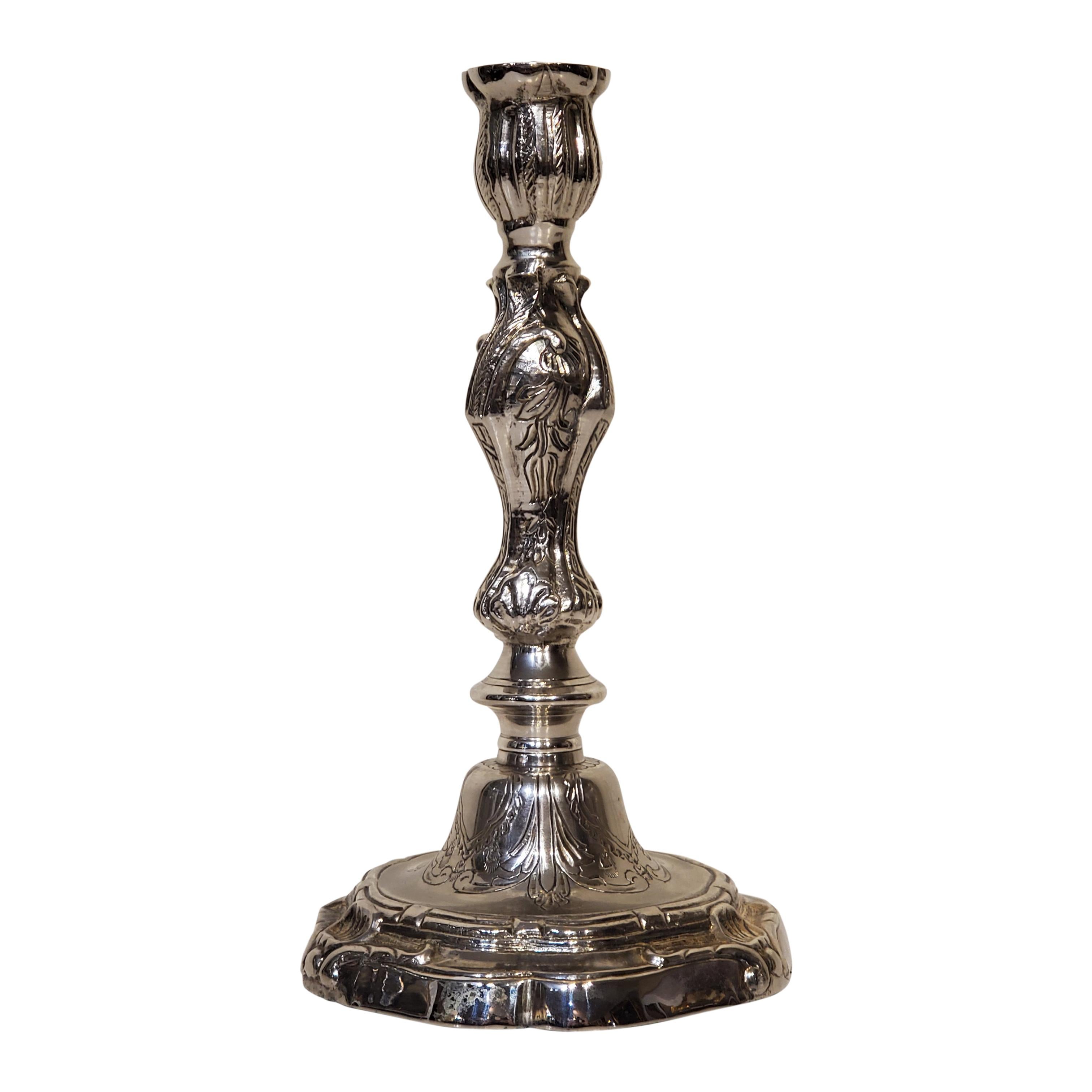 Pair of Louis XV style silver plated candlesticks. Also available as electrified candlestick lamps.

These were custom cast from 18th century bronze candlesticks and measure 9.5 inches tall by 5.5 inches wide by 5.5 inches deep.

Note the