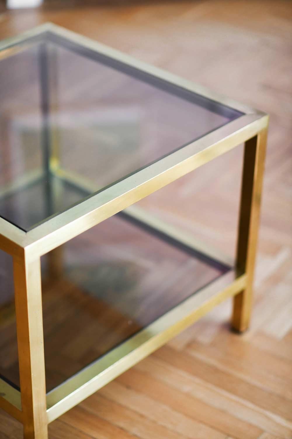 Pair of 70's coffee tables in brass and brown glass with two shelves.
1970s Italian manufacture.