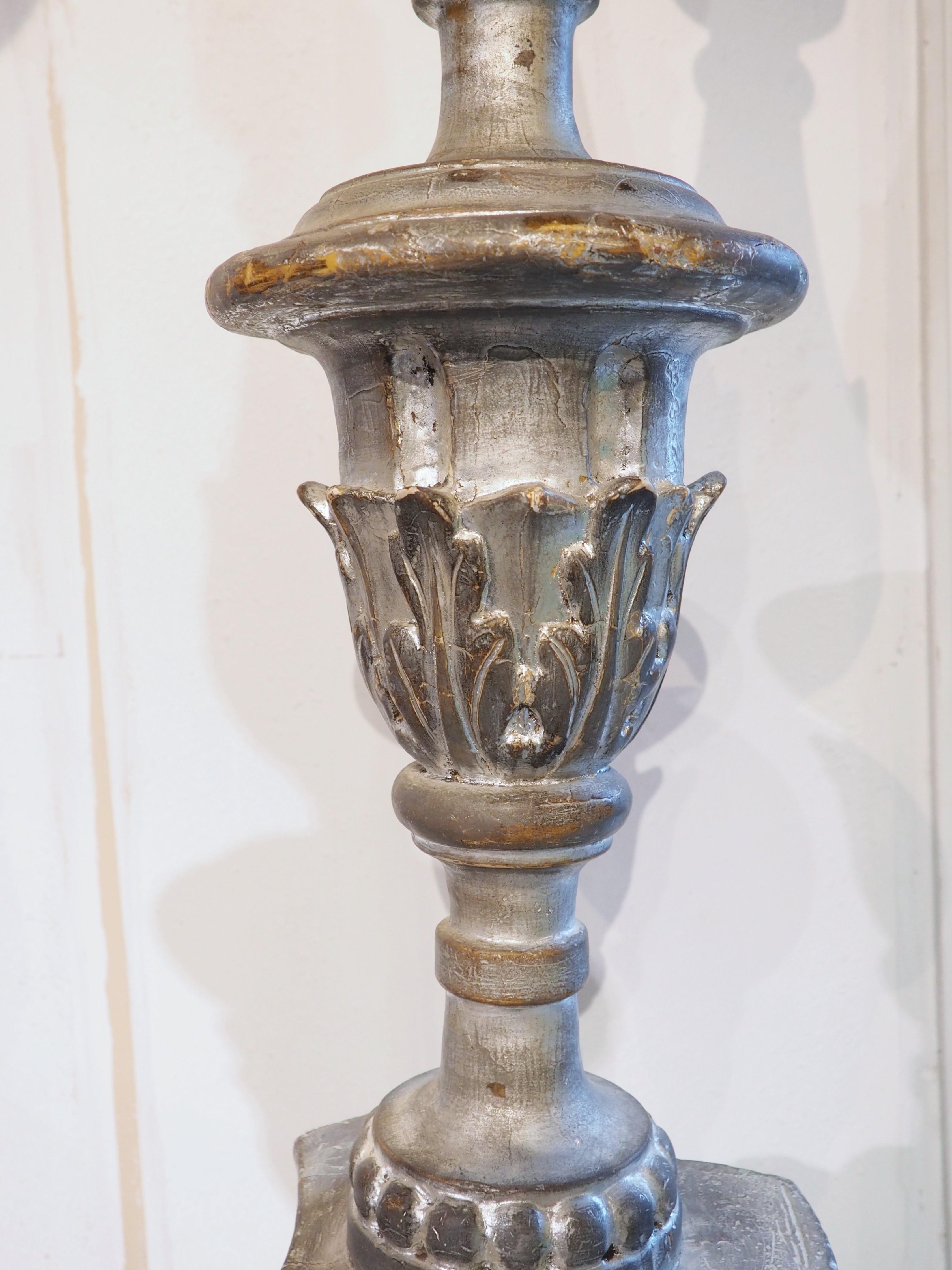 At over six feet tall (both measure around 76 inches), these torchère candlesticks have a commanding presence, enhanced by a silver gilt finish. Hand-carved in Italy, circa 1800, the candlesticks feature various leafy and geometric carvings.

A 2