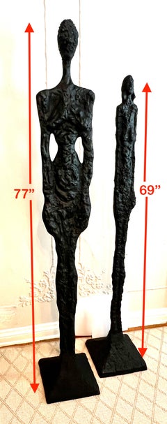Pair of 77 inch Male and 69 inch Female Sculptures in The Style of Giacometti