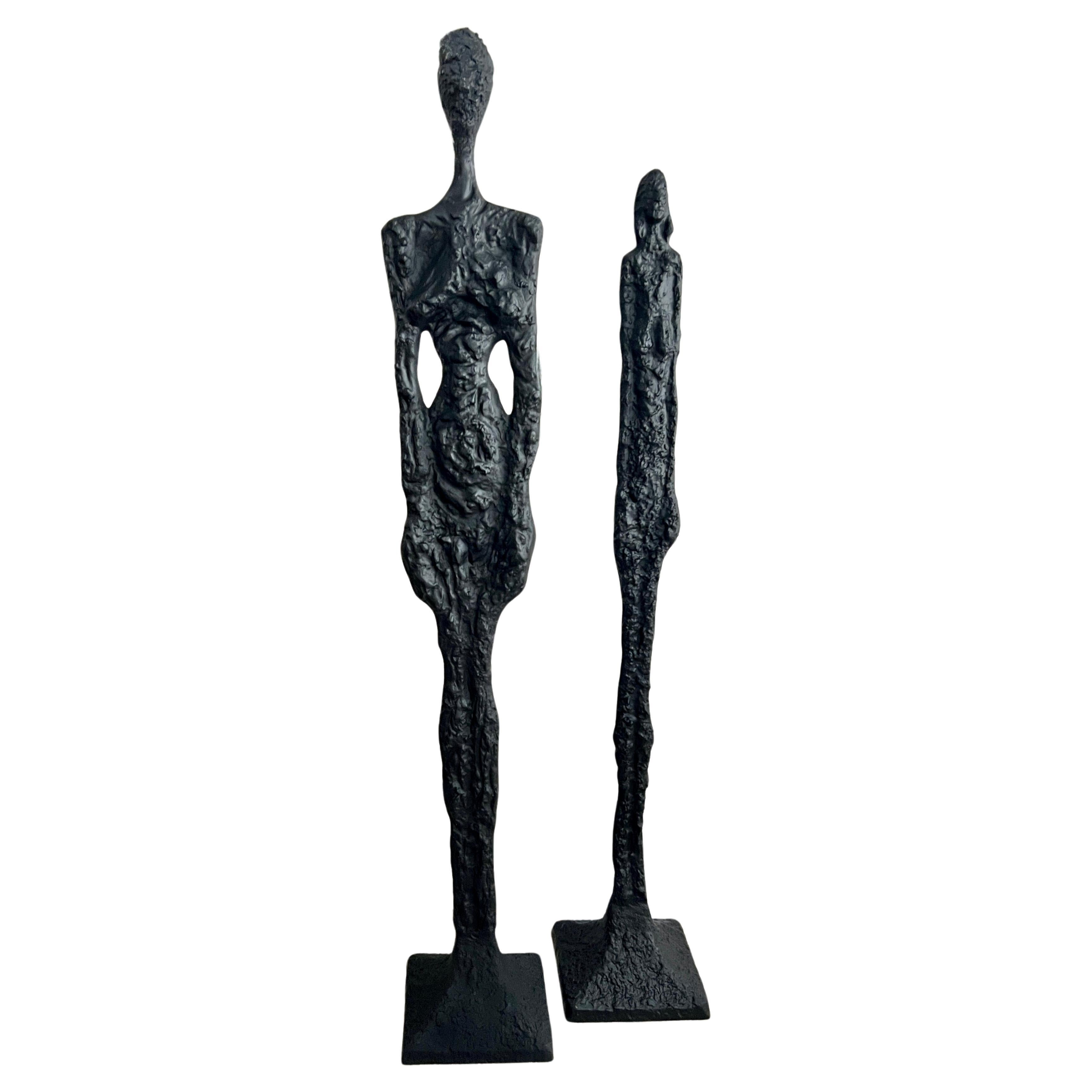 Pair of 77 inch Male and 69 inch Female Sculptures in The Style of Giacometti For Sale