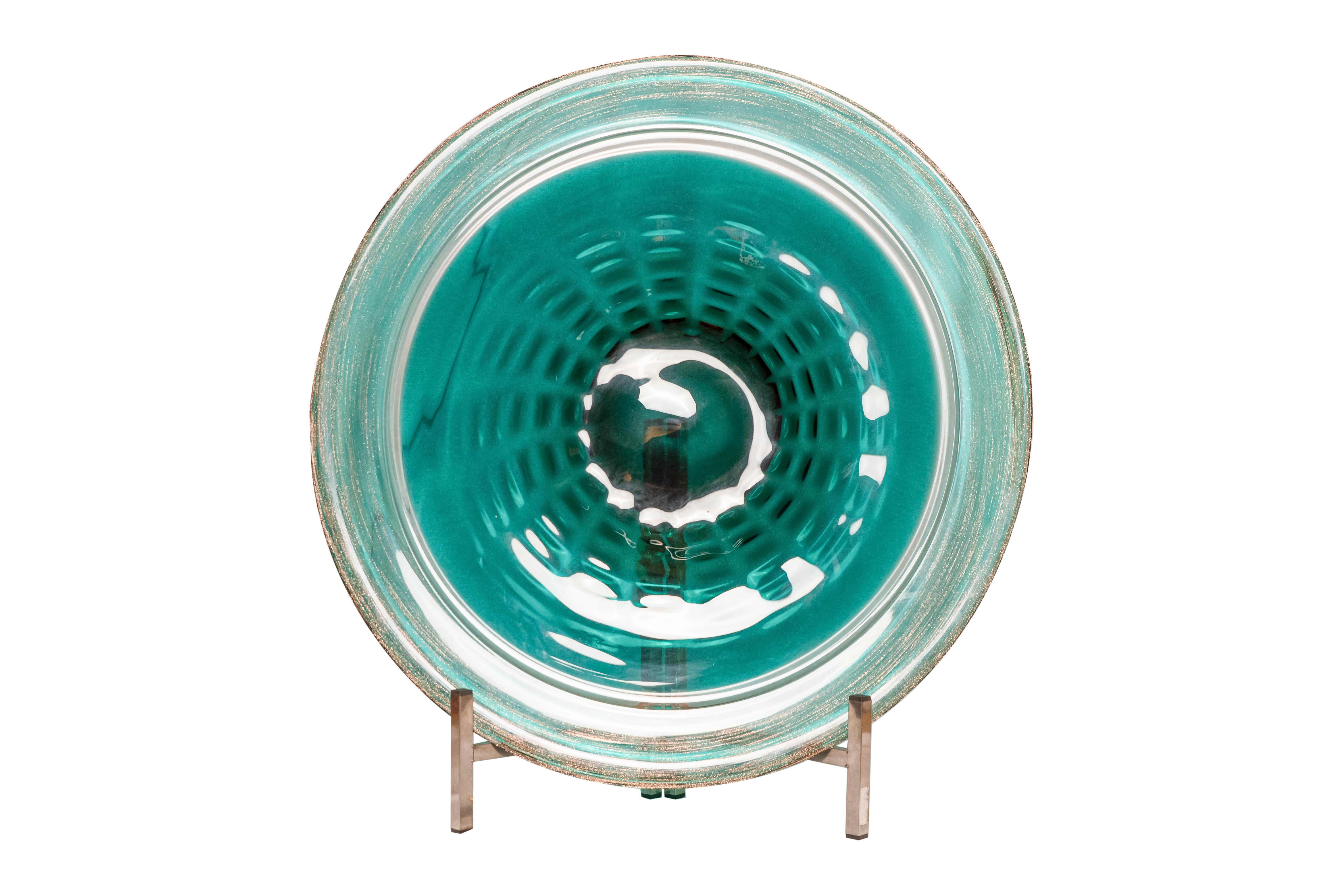 Pair of late 80s 90s turquoise blue and gold Murano hand blown glass plates or grand fruitplates, on chromed stalks.
In the manner of Venini, no signature found.