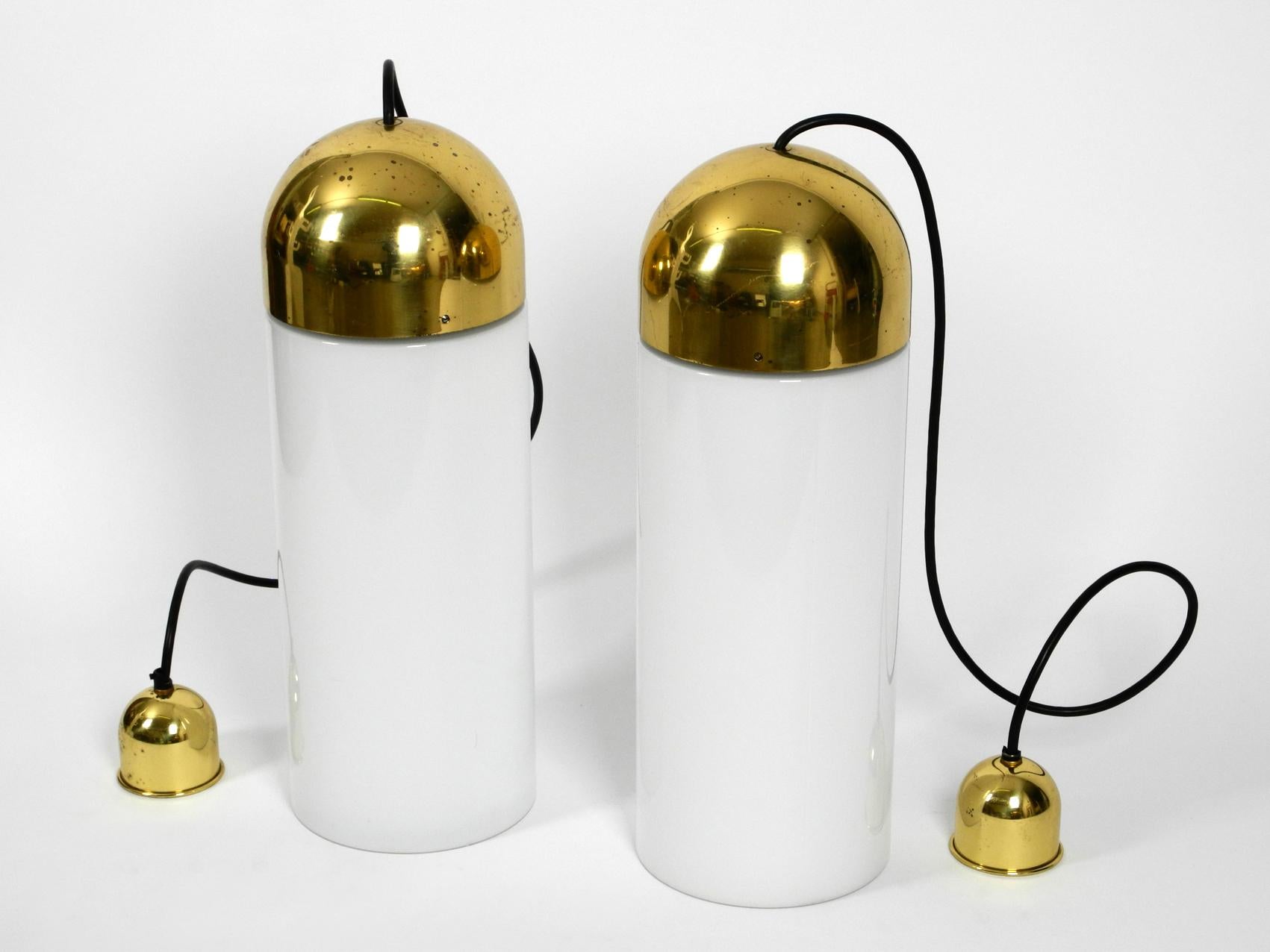 Pair of very rare extra-large glass church lamps with brass tops. Made by Limburg in the 1980s.
Made in Germany. Very good condition. The brass domes have some patina and 2-3 slight bumps.
A glass has a chipping on the thread. You no longer see