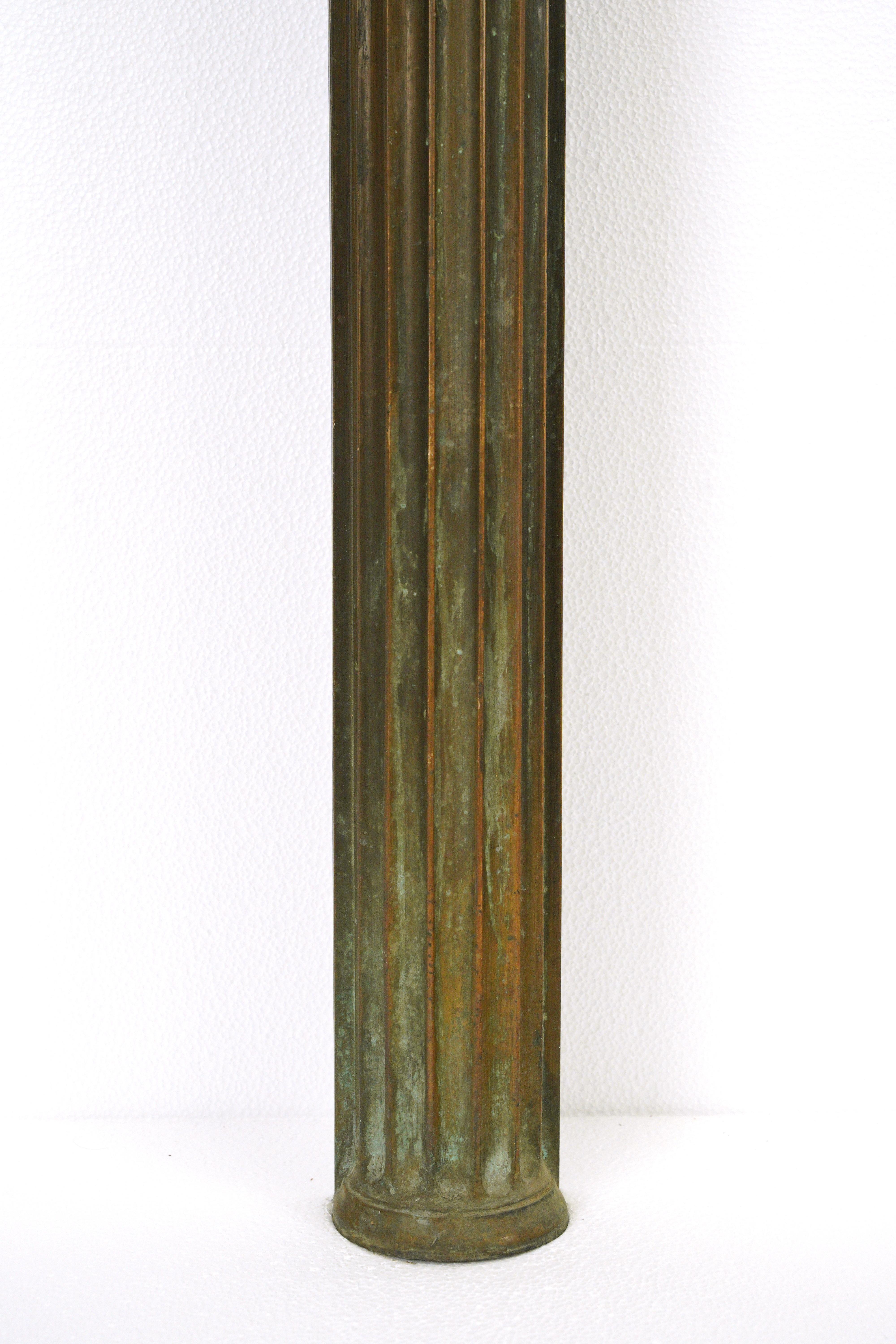 These decorative columns are made of bronze with flat hollow backs. Good condition with appropriate wear from age. One has two grooves cut out on the left side. Priced as a pair. Please note, this item is located in our NYC location.   