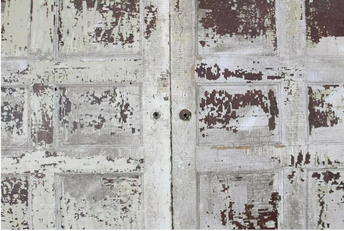 Pair of 9' Antique Distressed Painted White Pocket Doors In Distressed Condition For Sale In Chicago, IL