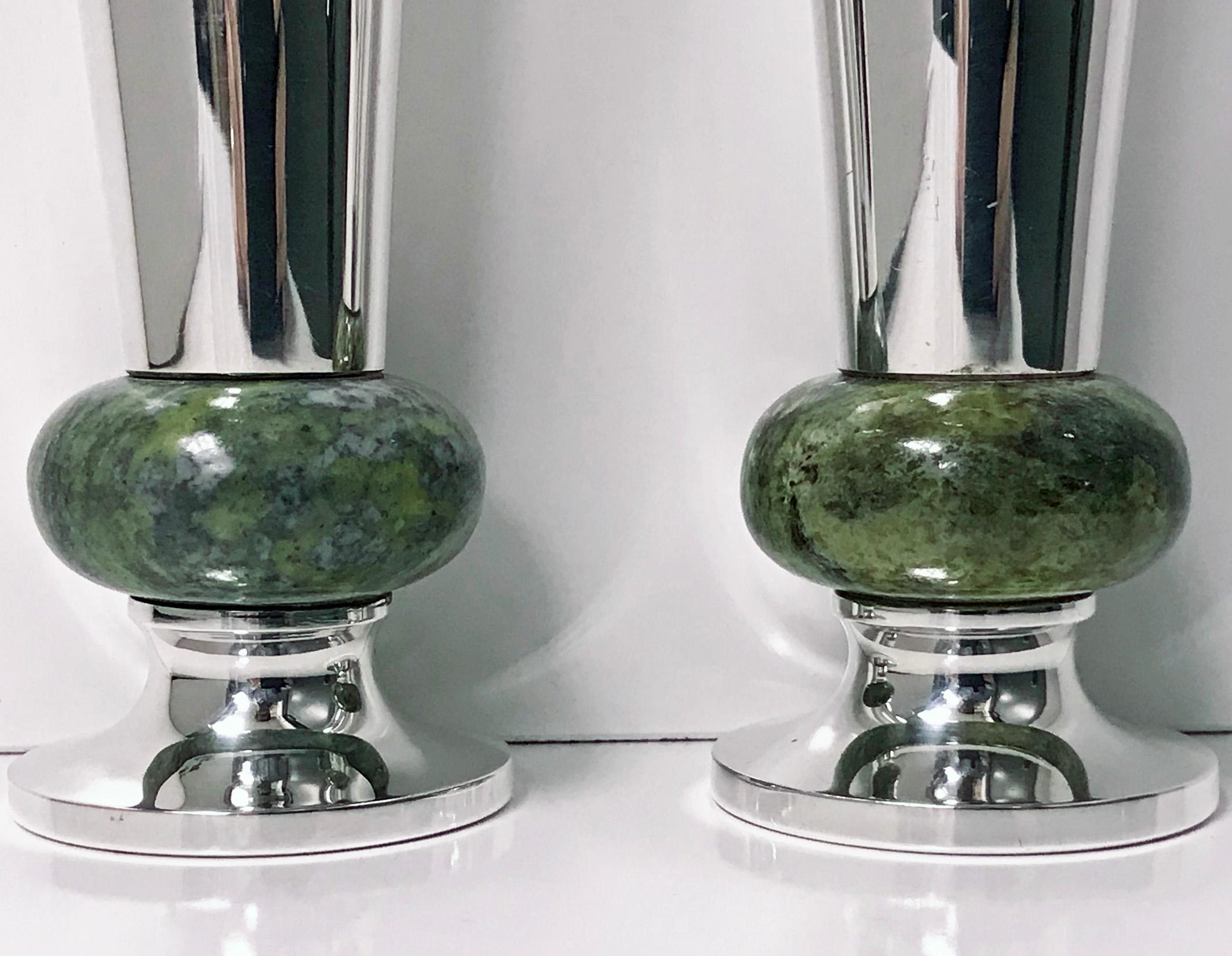 Pair of A E Jones sterling silver and marble vases, Birmingham, 1972. Each of flared slightly tapered form on round bases rising to a green marble bulbous knop surround. Fully hallmarked on vase and further hallmarks on underside of base including