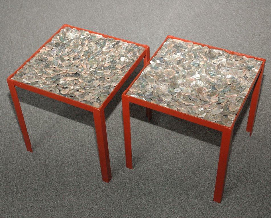 Pair of Abalone shell tables in the style of Tony Duquette.
The Coral colored finished metal table bases feature the hand placed 
tumbled Abalone shells to create these beautiful tables.