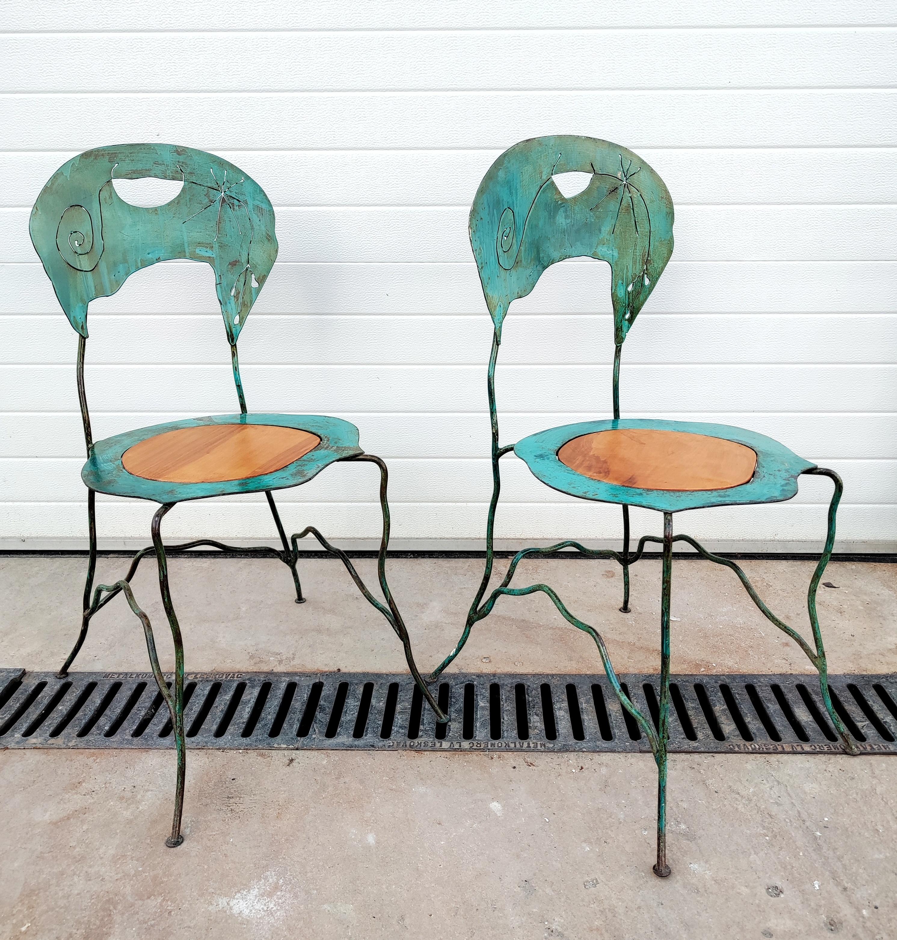 In this listing you will find a Pair of Extremally Rare Abstract and Very Sculptural Art Chairs designed by Bohuslav Horak (attr.). They are handmade of iron painted in green and wood and they feature beautiful, uneven lines with carvings in their