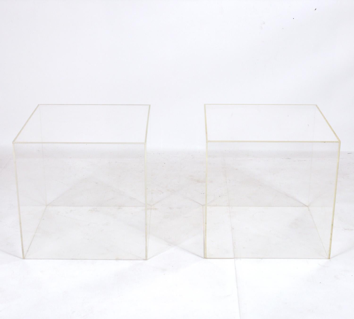 Pair of Acrylic or Lucite end or side tables, American, circa 1980s. They are a versatile size and can be used as end or side tables, or as night stands. They were made without a bottom panel, so you could display or store items underneath them.