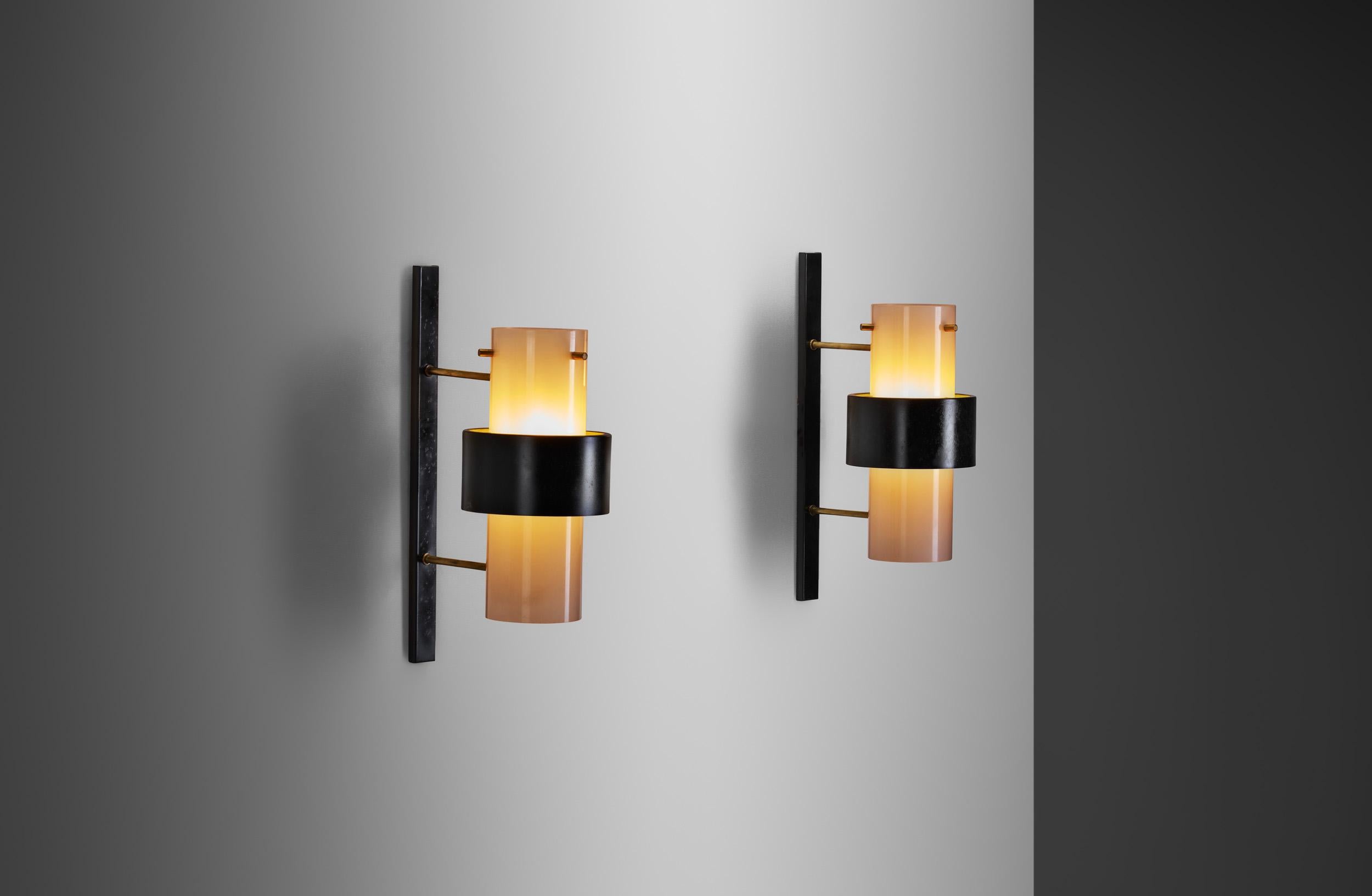 This pair of double sconce wall lights from Maison Lunel are imposing models of an era that saw the creation of some of the most famous lighting designs ever created. From the unique design and materials to the innovative techniques, these sconces