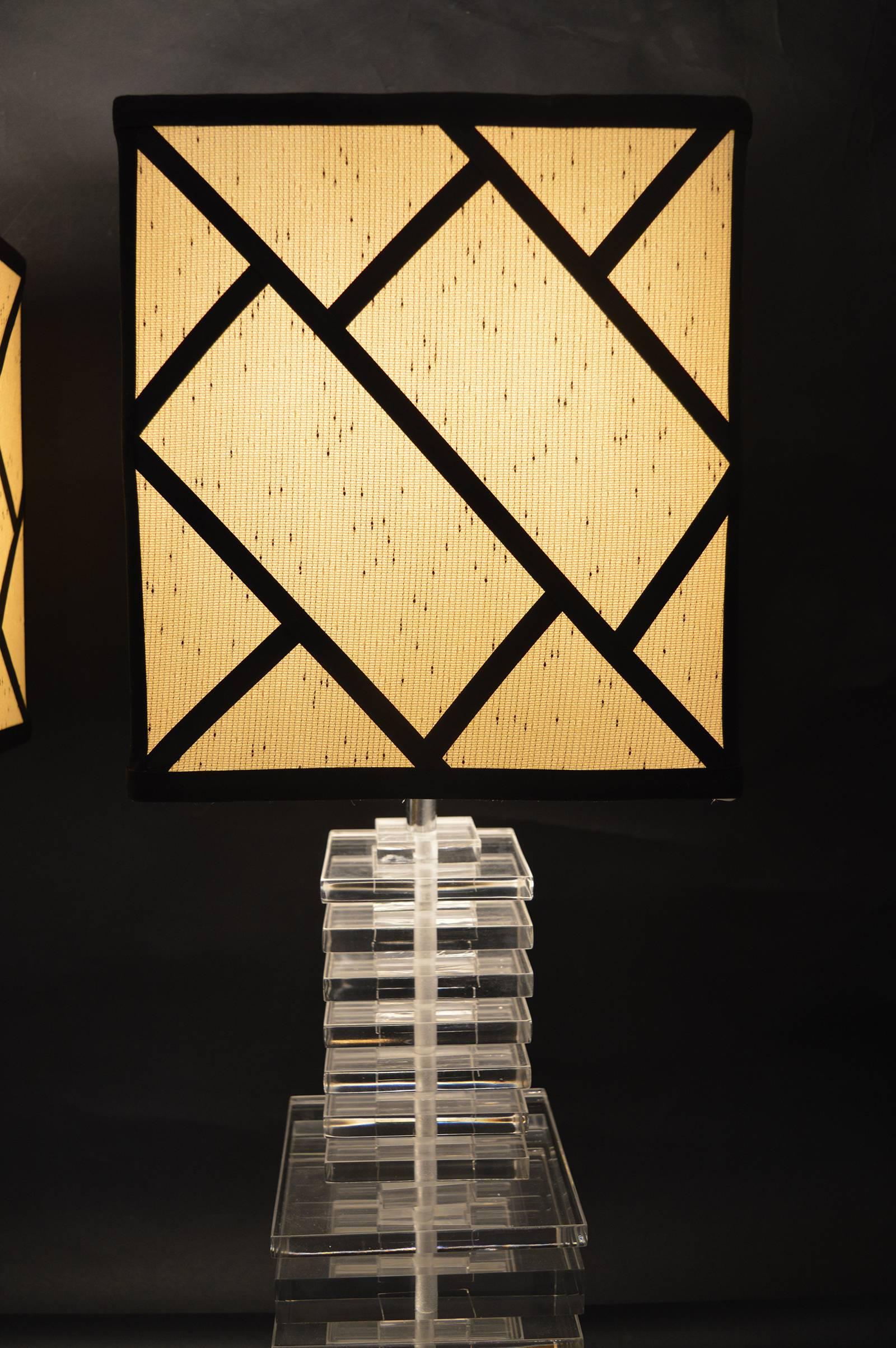 Pair of stacked acrylic lamps.