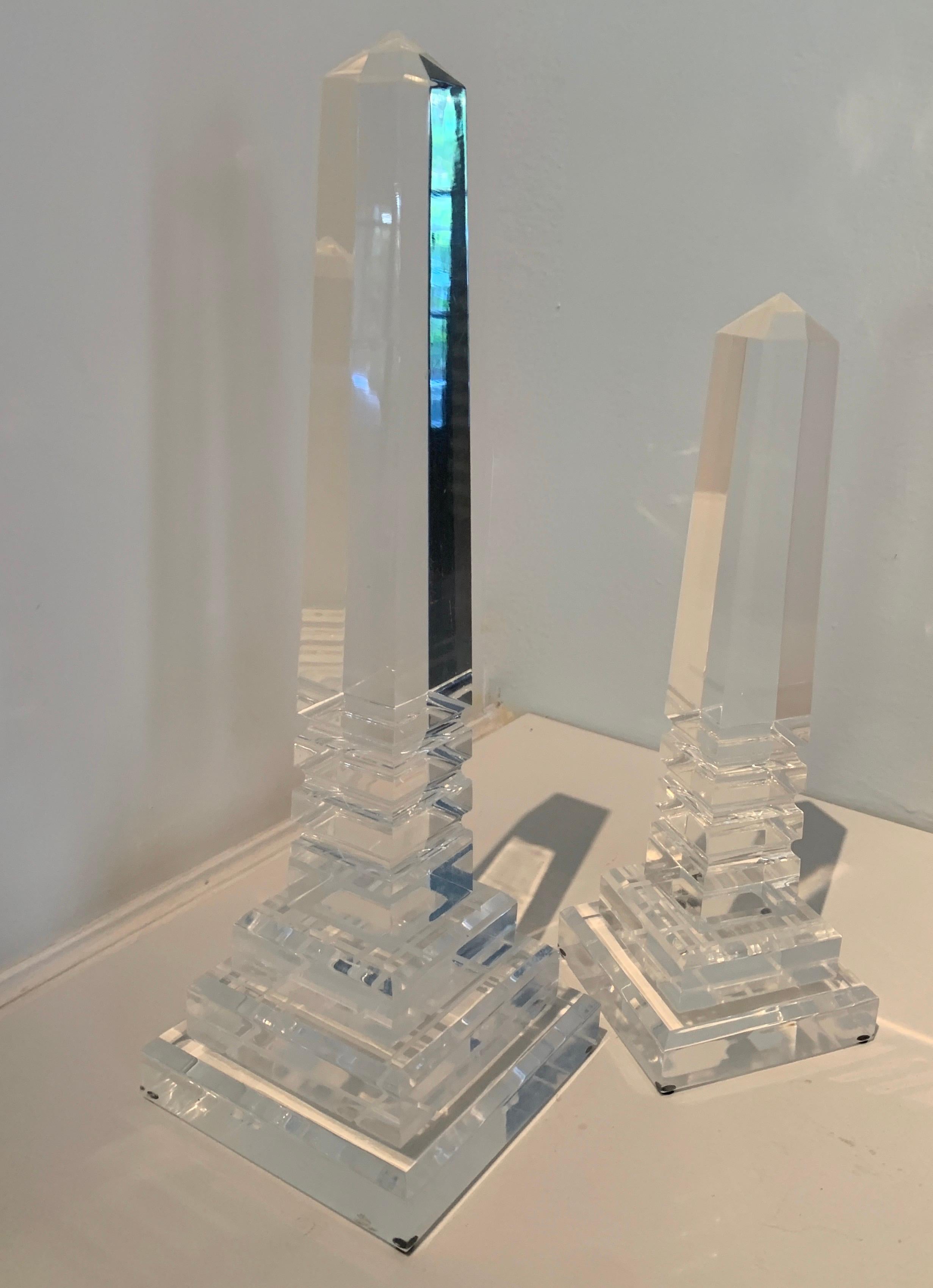 Very modern and sleek pair of acrylic obelisks. The pair are the perfect compliment to any space - interiors from modern to traditional.