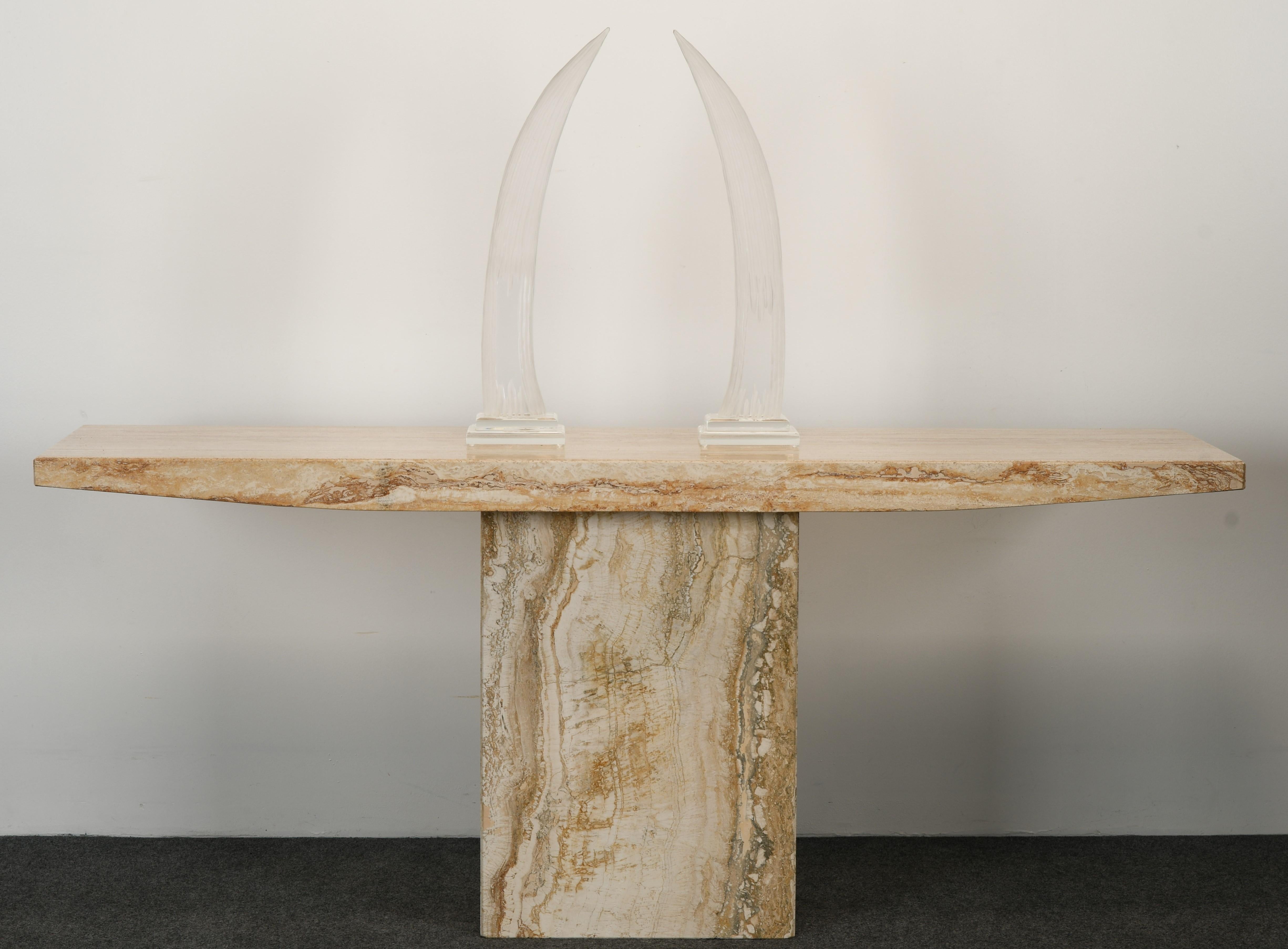 An impressive pair of decorative acrylic or Lucite tusks by Van Teal. These tusks would work well on a decorative console table or mantel (fireplace). They have great form and substantial size. Signed on top of base 