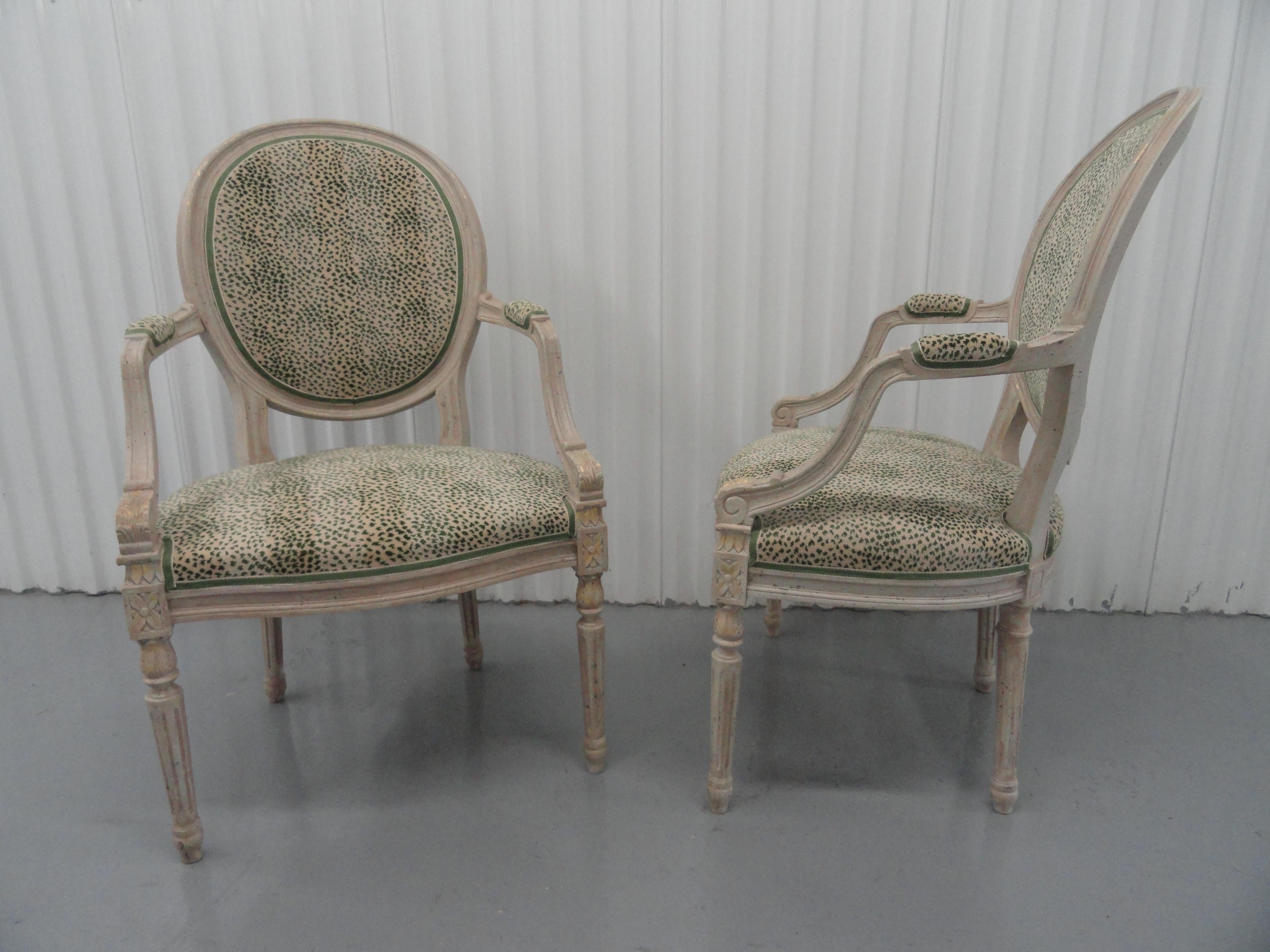 Pair of Adams-style chairs with a white distressed painted finish with gold detail. Chairs are upholstered in a Clarence House cotton.
Mid-20th century. Excellent condition.