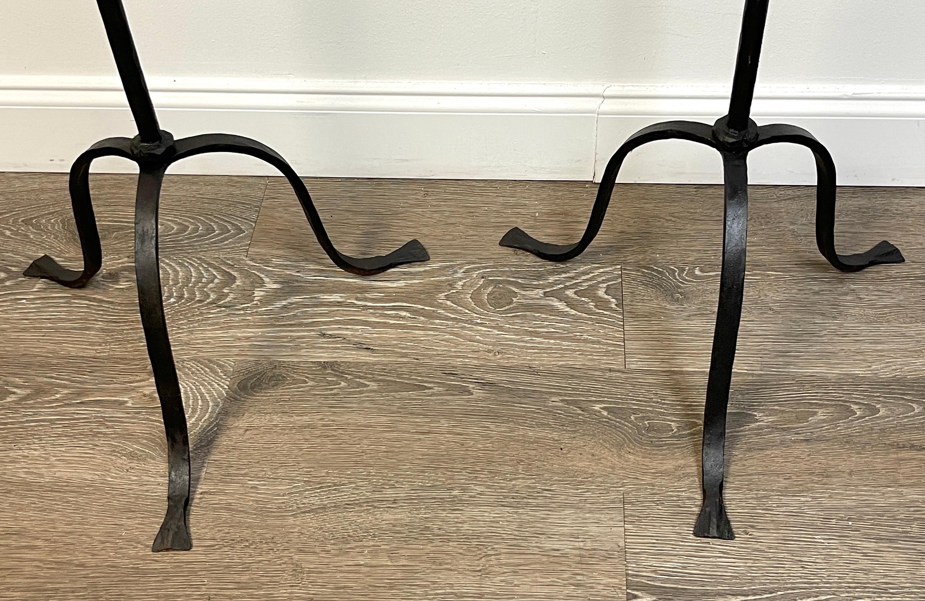 Pair of Addison Mizner, attributed wrought iron floor candelabra/ torcheres*
USA, Circa 1930s
Attributed to Addison Mizner (1872 -1933) 
Provenance: Palm Beach Estate

Each wrought iron floor candelabra/ torcheres is of exceptional proportions, with