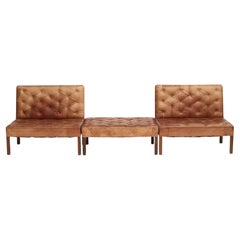 Pair of Addition Leather Sofas and a Low bench/stool By Kaare Klint