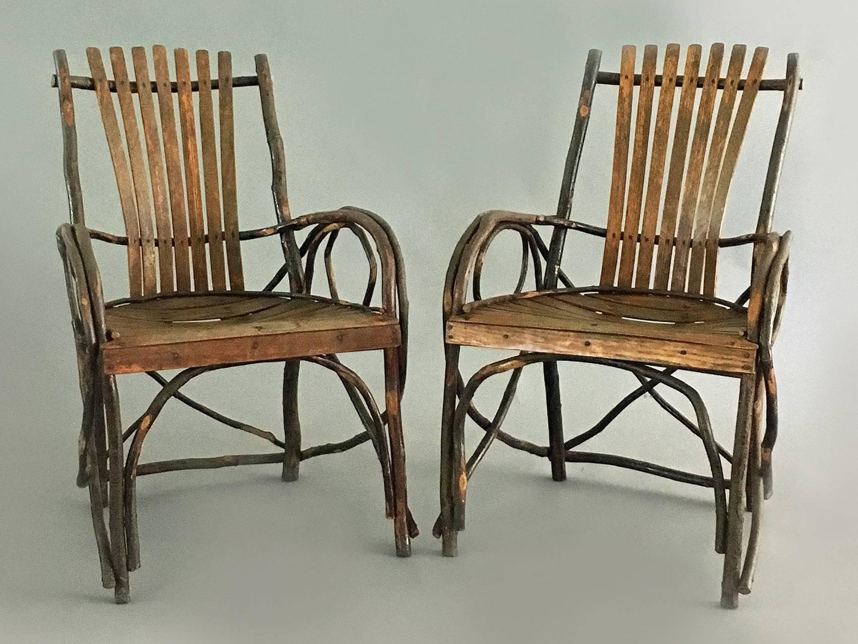 Charming pair of Adirondack oak and willow bent twig armchairs, the back made of vertical slats, the seat of horizontal slats, the arms are bent in circles. They are extremely comfortable.