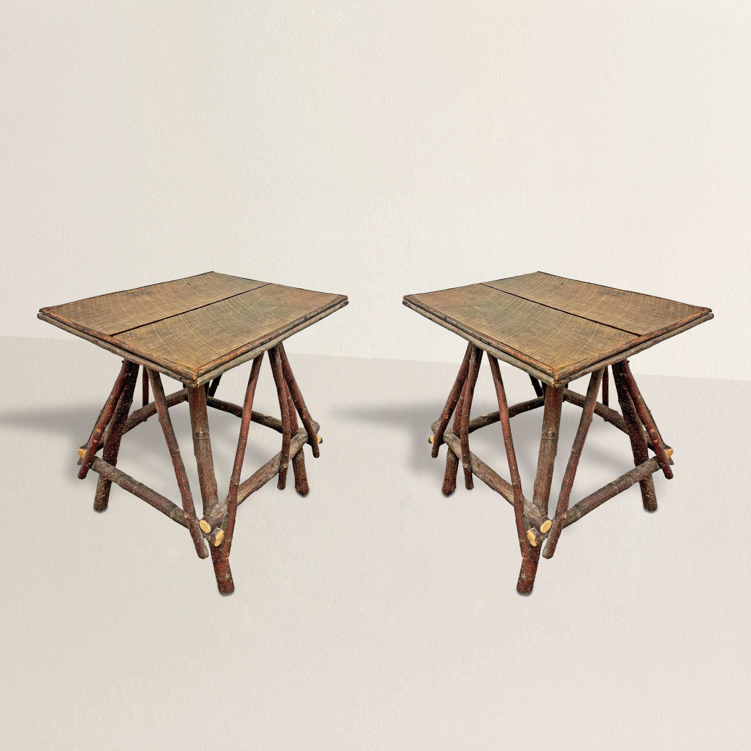 This pair of 21st-century American tables breathes new life into the Adirondack style, merging the timeless appeal of rustic design with contemporary craftsmanship. Constructed with bases of found twigs, arranged with an eye for architectural
