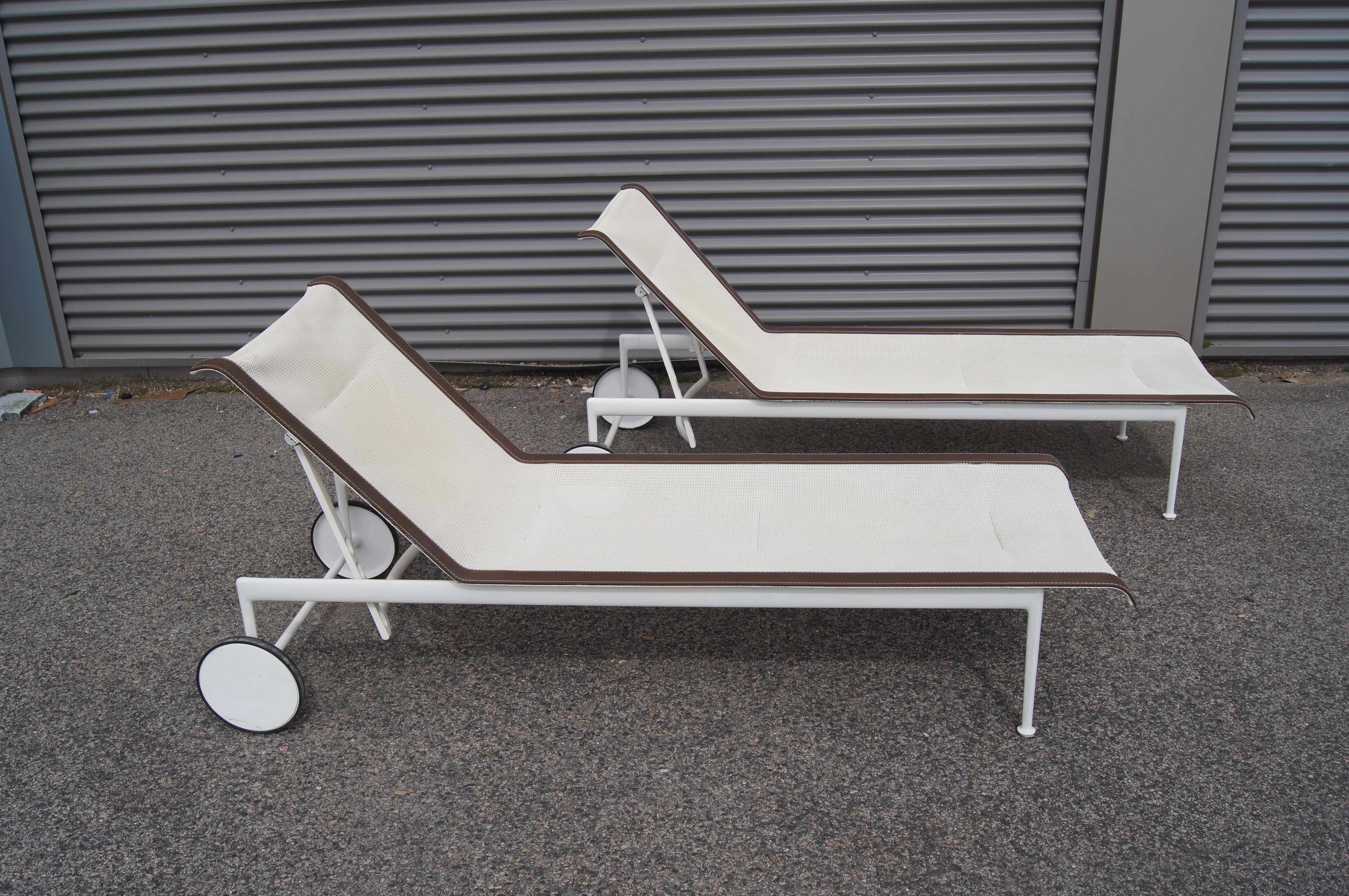 Richard Schultz originally designed his minimalist 1966 Collection of outdoor furniture for Florence Knoll's Florida residence. For this pair of chaise lounges slender frames of white powder-coated aluminum adjust along various angles of recline to