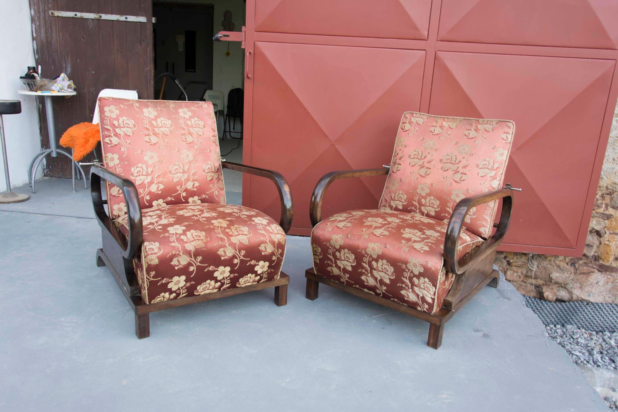 These armchairs were designed in the 1930s and made in Bohemia. They feature backrests and seats that can be set in four different positions. The frames are made of beech in combination with walnut and the pieces features original upholstery with