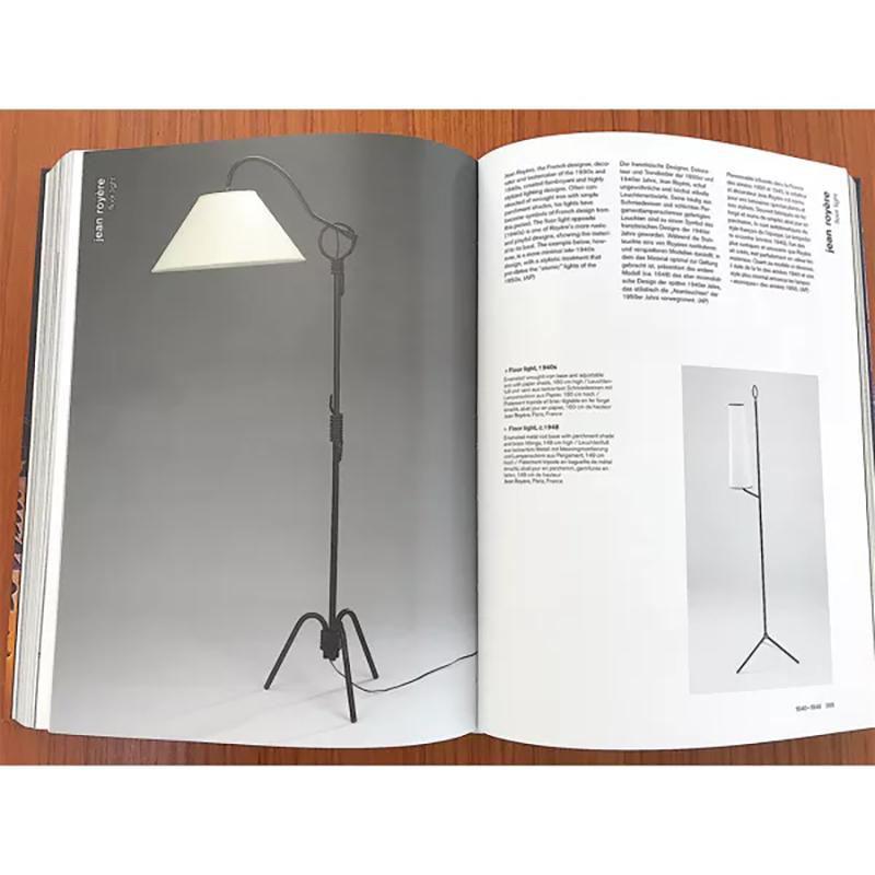 Pareja de lámparas de pie regulables de hierro de mediados del siglo XX según Jean Royère en venta 2