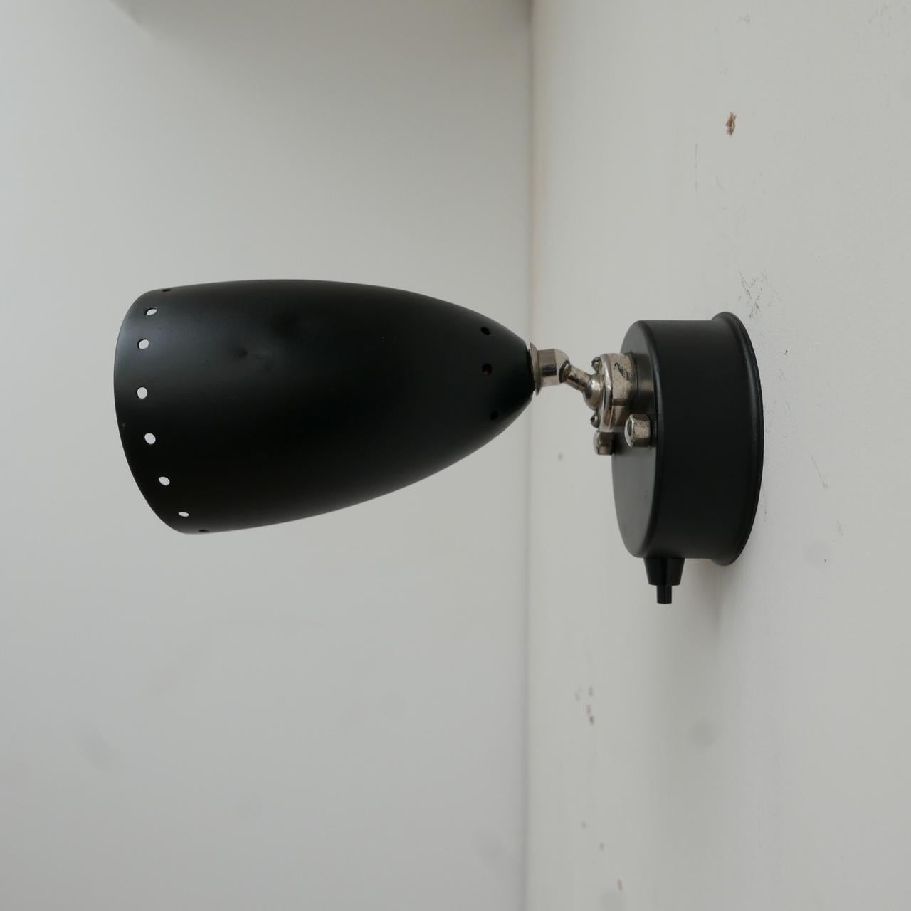 A pair of adjustable wall lights. 

Several pairs available. 

Can be sprayed in black or other colours. 

Some small dings and dents commensurate with age but generally good condition. 

Metal shades with polished chrome 'necks'.

Price
