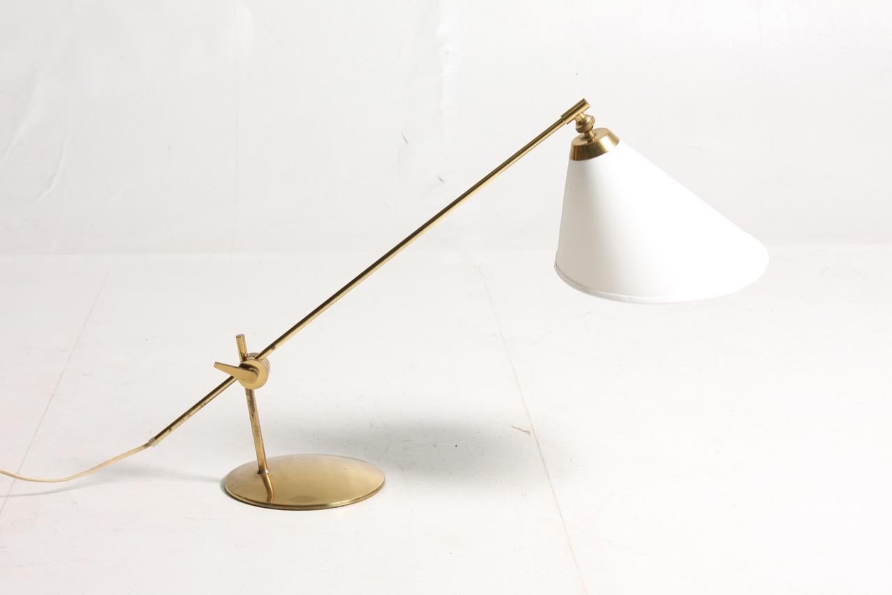 Pair of adjustable table lamps in brass. Made by Poul Dinesen in 1950s. Made in Denmark.