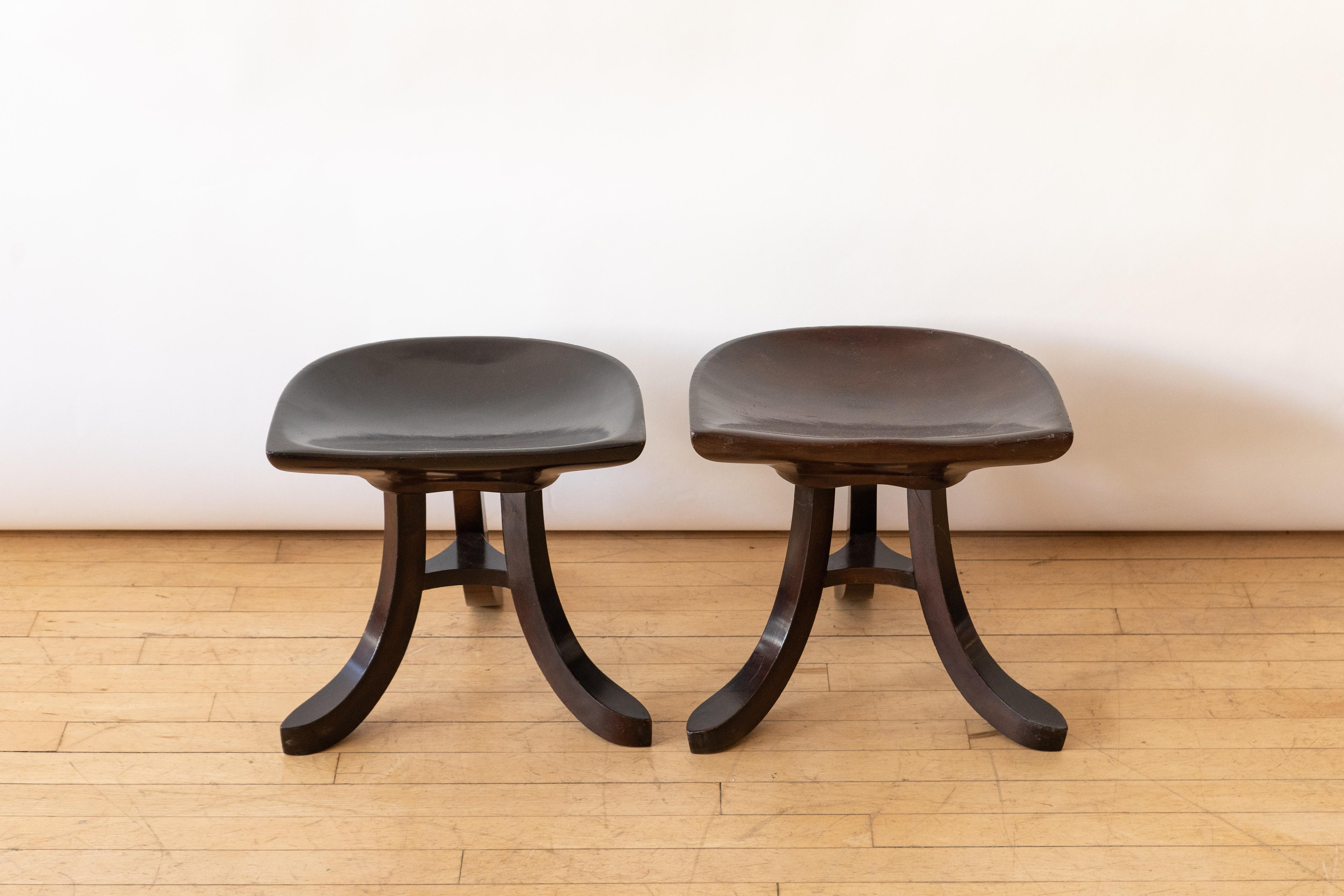 Austria, ca. 1950s. An attractive pair of three-legged stools in the manner of architect Adolf Loos (1870-1933). Originally designed in 1915 for the Villa Duschnitz in Vienna, and referred to as “Theban” or “Egyptian” stools, these were inspired by