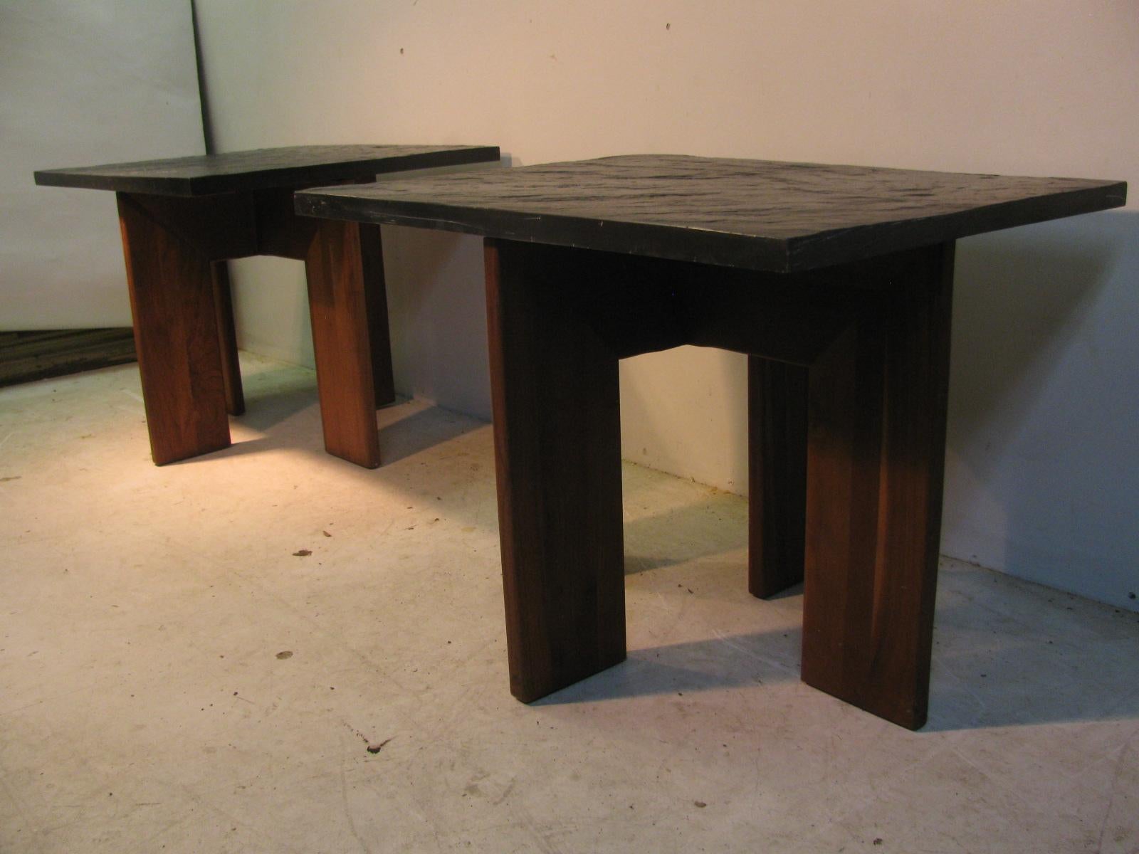 Fabulous pair of walnut base tables with slate stone tops. Simple and elegant in their nature, these tables are hard to come by. In very good condition with excellent color and stability.