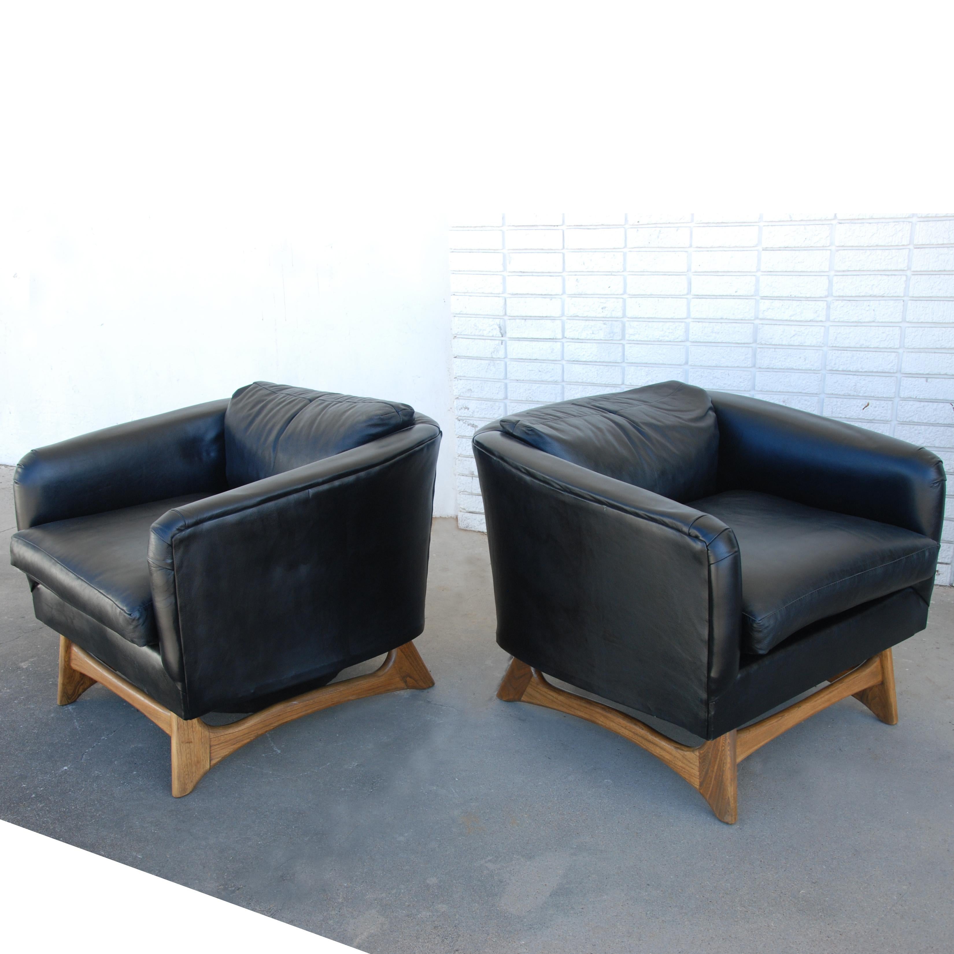 A pair of lounge chairs designed by Adrian Pearsall and made by Craft Associates. New black leather upholstery with Pearsall's signature walnut sculptural bases.