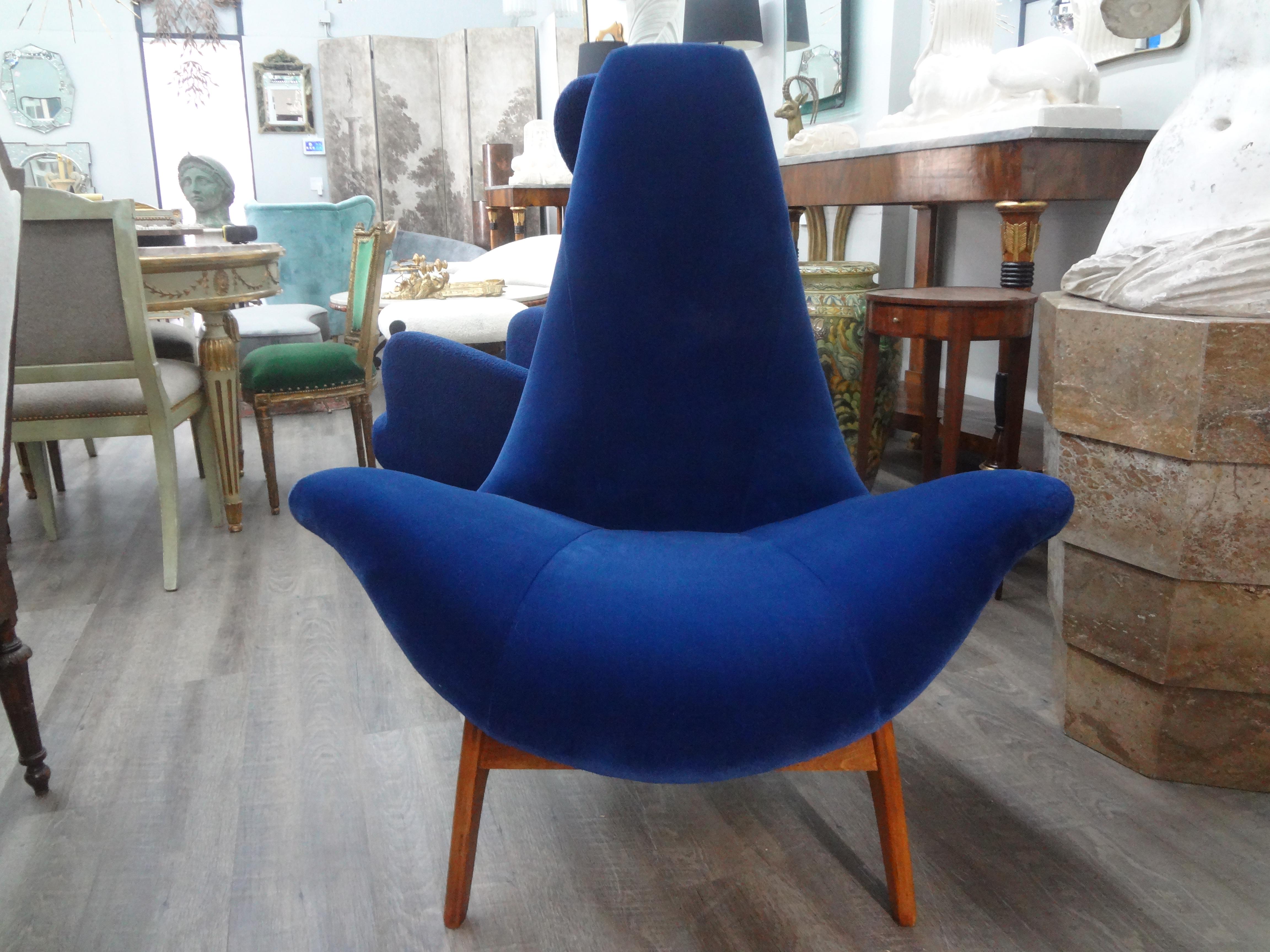 Pair Of Adrian Pearsall Gondola Lounge Chairs. This iconic pair of sculptural gondola lounge chairs, scoop chairs or wing chairs have a floating design and have been professionally upholstered in plush navy blue mohair fabric.
These large lounge