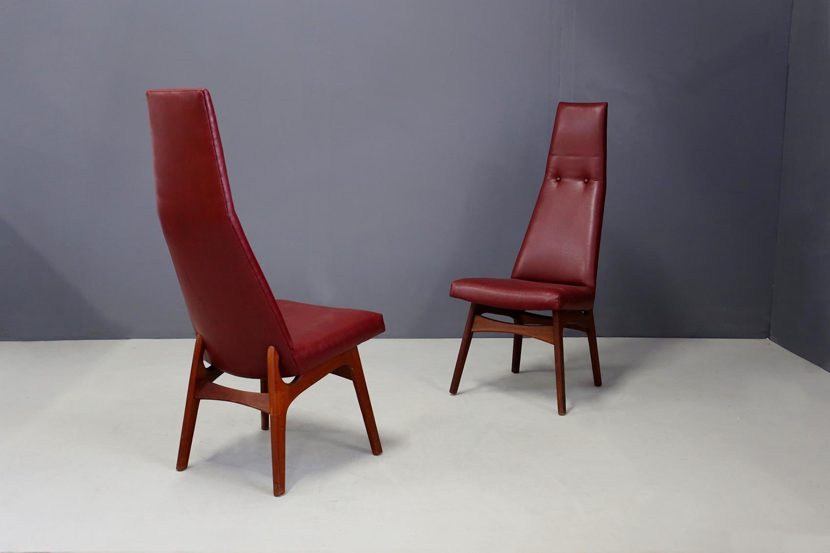 Rare set of pair of dining chairs by Adrian Pearsall for Craft Associates. The pair has been restored but still retains its original period fabric. Its upholstery is in burgundy leather in perfect condition. The pair of chairs is from circa 1950.