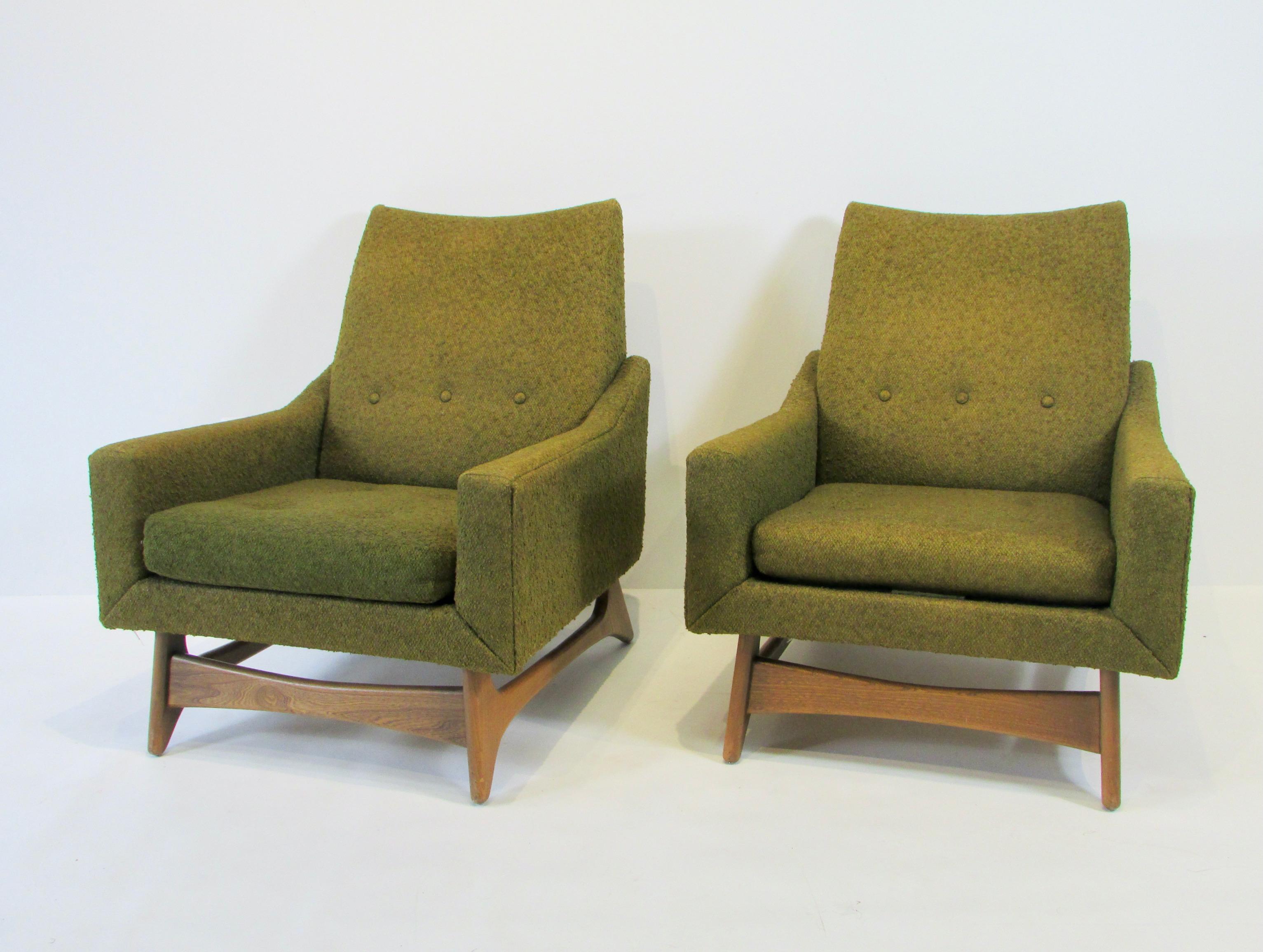 Pair of Kroehler armchairs from the leisure collection 1966. Upholstered frames on walnut bases. Chairs are as found originals with original label on one chair. Upholstery is faded and worn. Ready for clients own recovering.