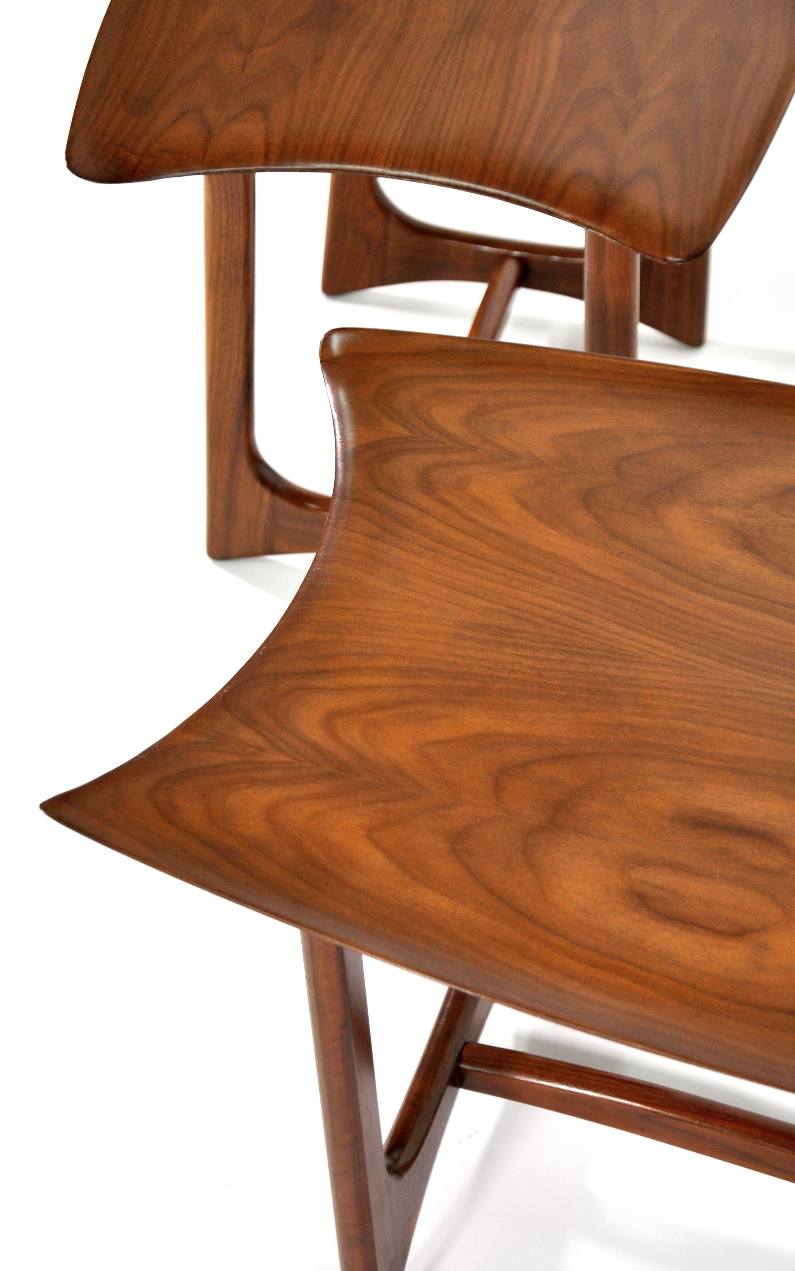 Stunning and exceedingly rare pair of sculptural walnut end or side tables, designed by the legendary Adrian Pearsall for Craft Associates in the 1950s. The vintage occasional tables feature a striking and unique design with organic form. These