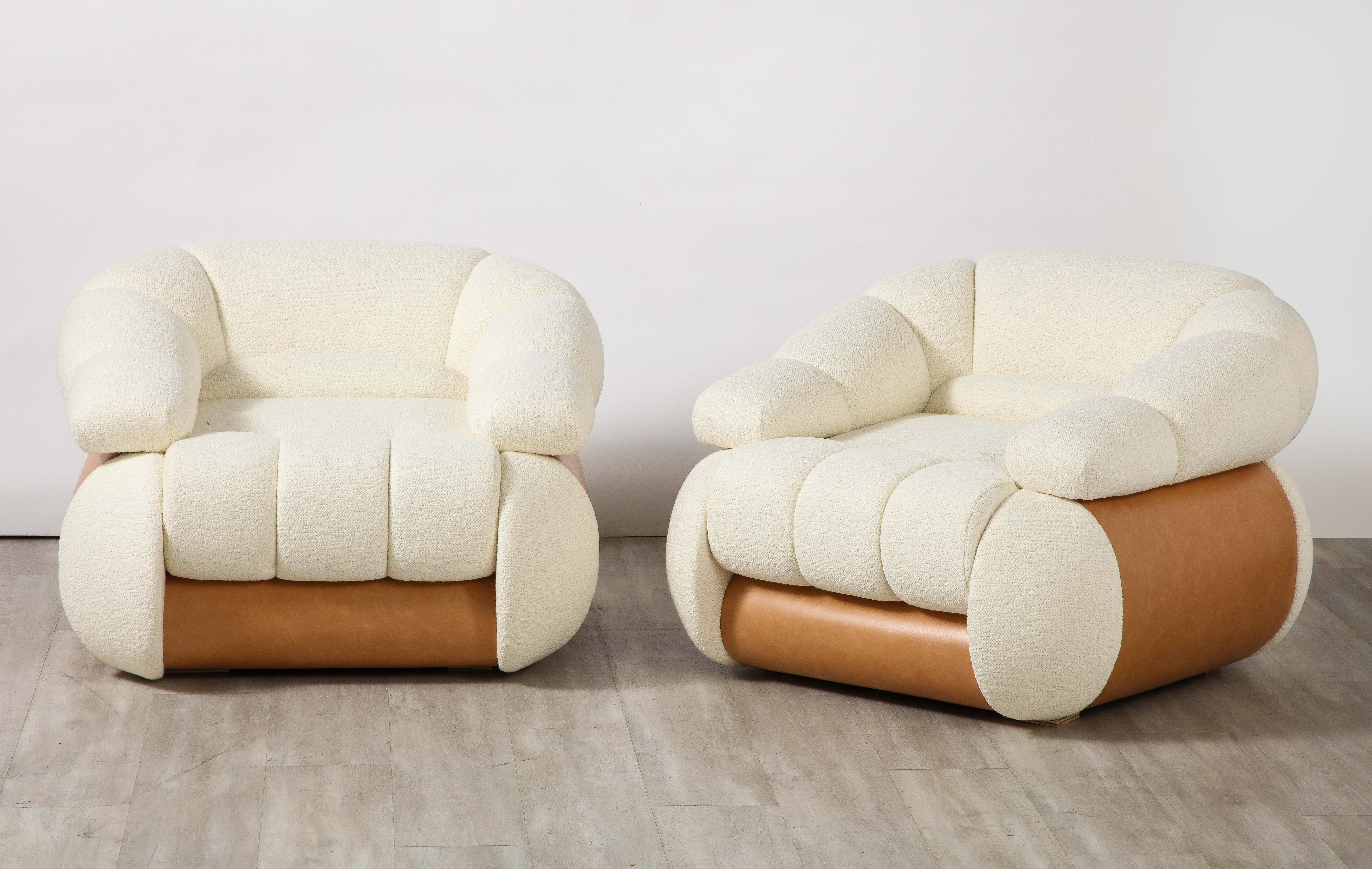 Pair of Adriano Piazzesi Italian 1970's lounge chairs; the whole with channel and tufted upholstery, the sides and back are curved and covered in a warm brown Italian leather. The chairs are constructed of original solid wood structure and have been