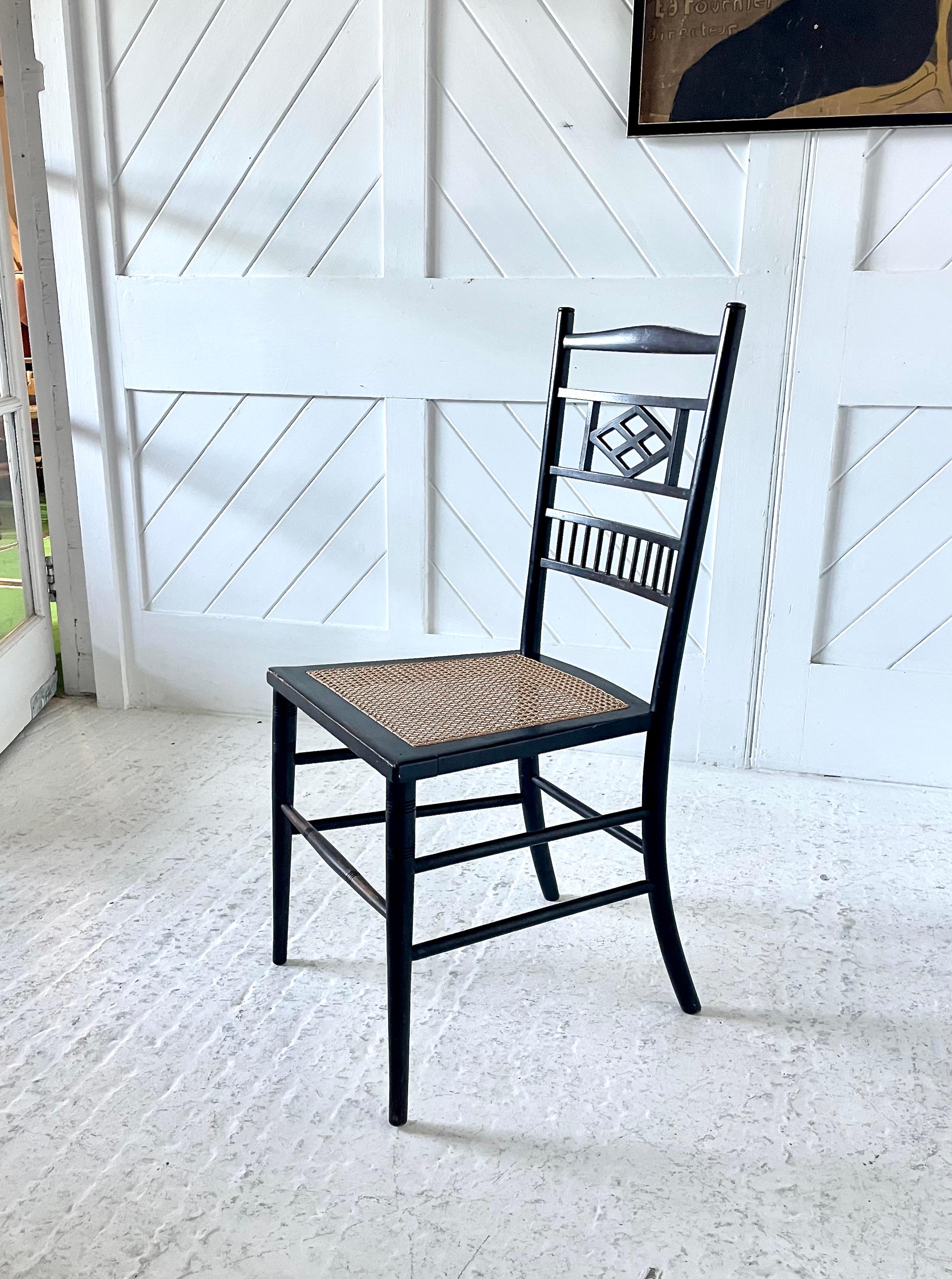 A pair of Aesthetic movement side chairs in ebonised beech with caned seats. Beautifully balanced light design with fine detailing. Godwin was an Archetect Designer of the Aesthetic period 1860-1890 in Britain he was an advocate of the Anglo -