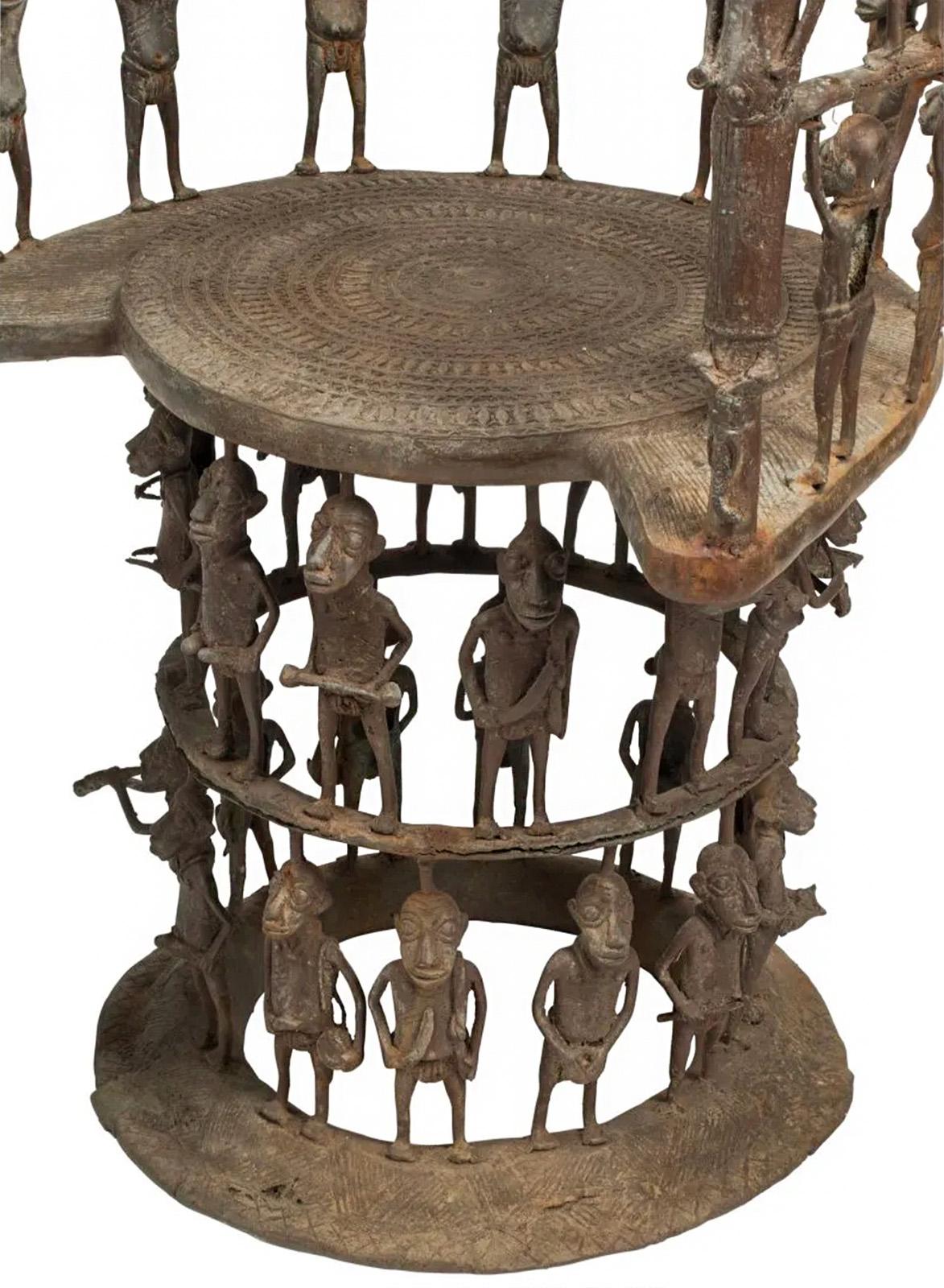 A pair of African bronze throne chairs with numerous figural sculptures on each. Made in a style that consciously references pieces from Benin, Cameroon, and other African cultures. 

Dimensions: 45
