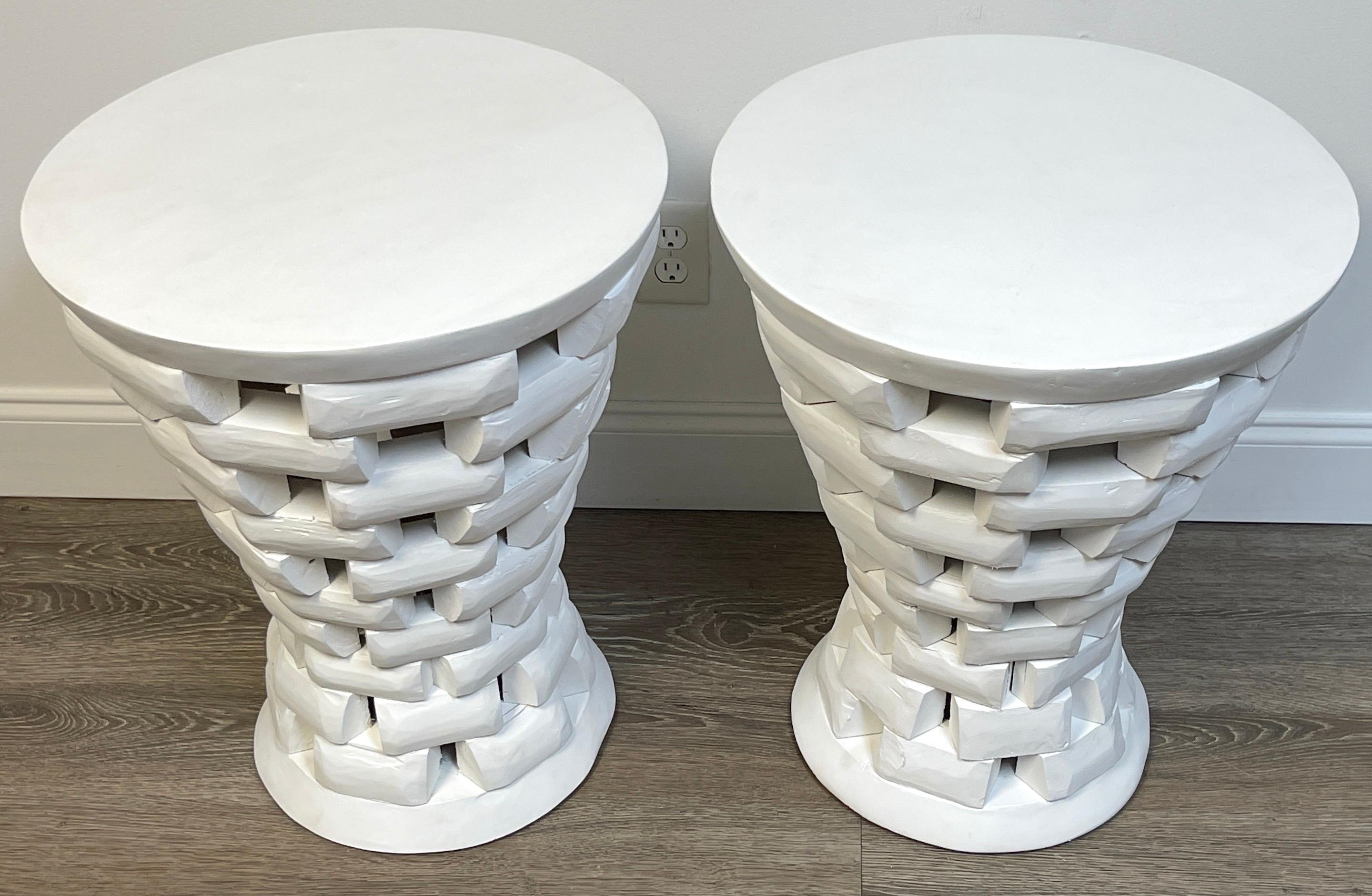 Pair of African style carved teak pedestal side tables, in white
A fine pair of modern hand carved teak pedestal side tables, each one with a 19.5-Inch diameter raised on continuous descending 10 brick high column, resting on 12-Inch diameter base.