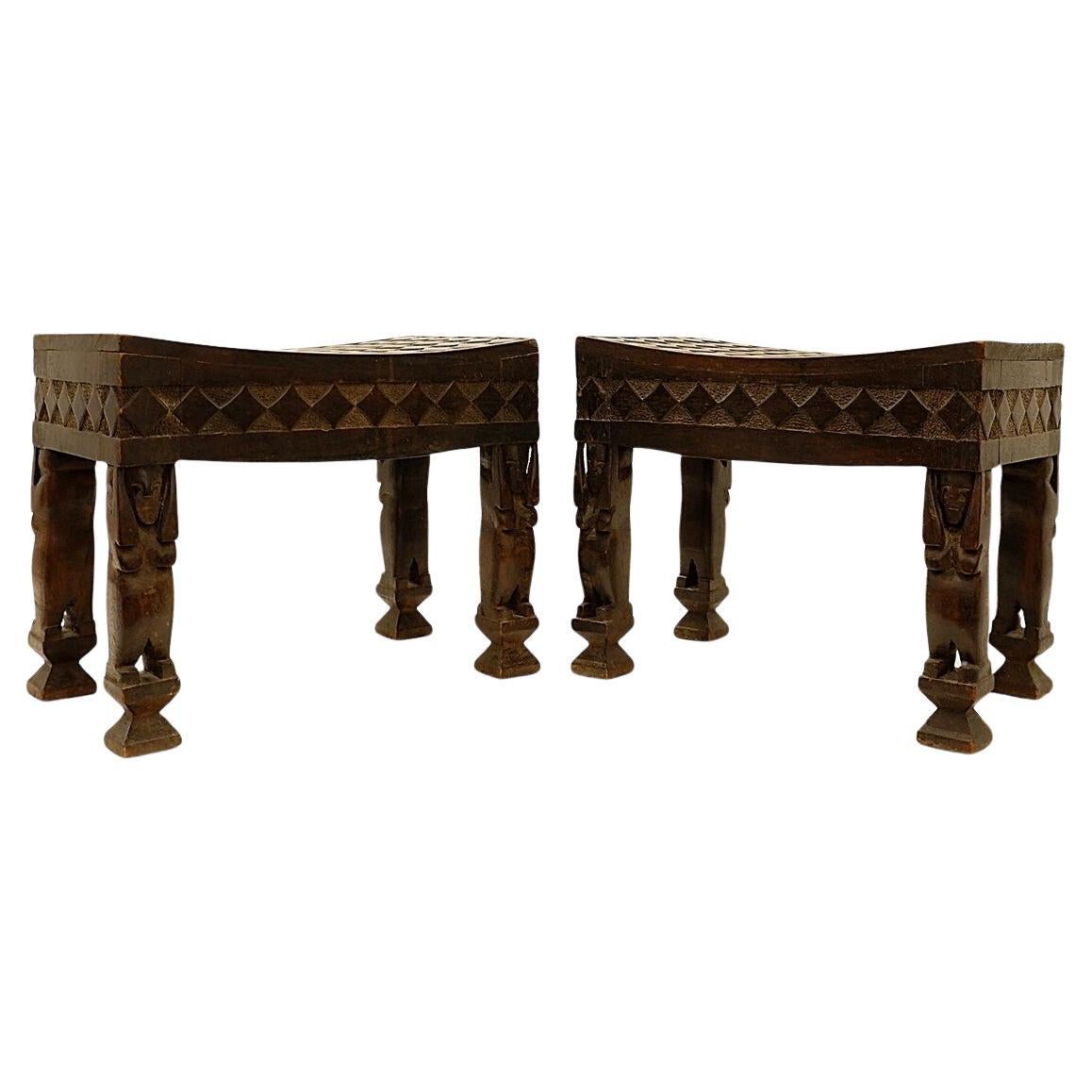 Pair of African carved wood stools For Sale