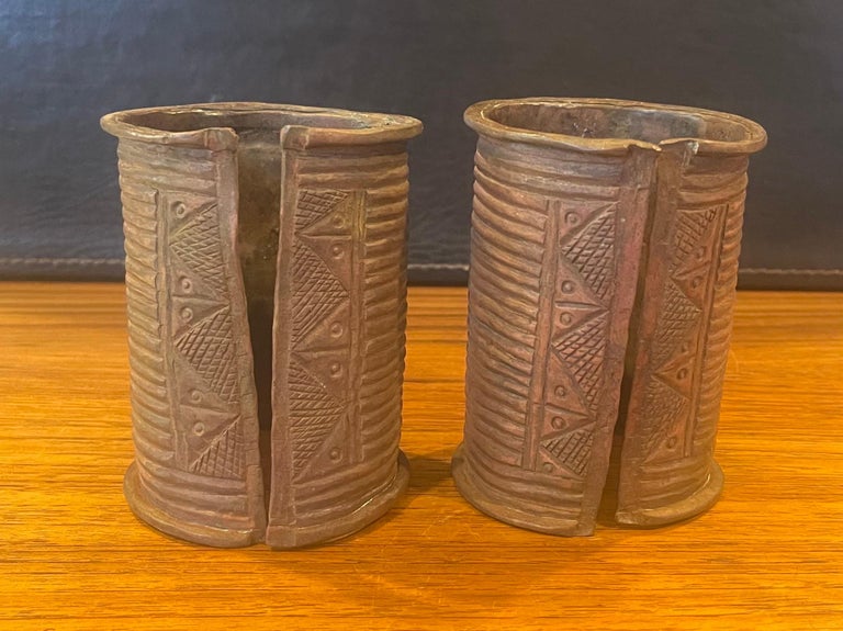 Pair of African Igbo Open-Sided Cast Copper Cuff Bracelets For