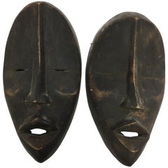 Pair of African Mid-Century Modernist Decorative Man and Woman Masks Sculptures