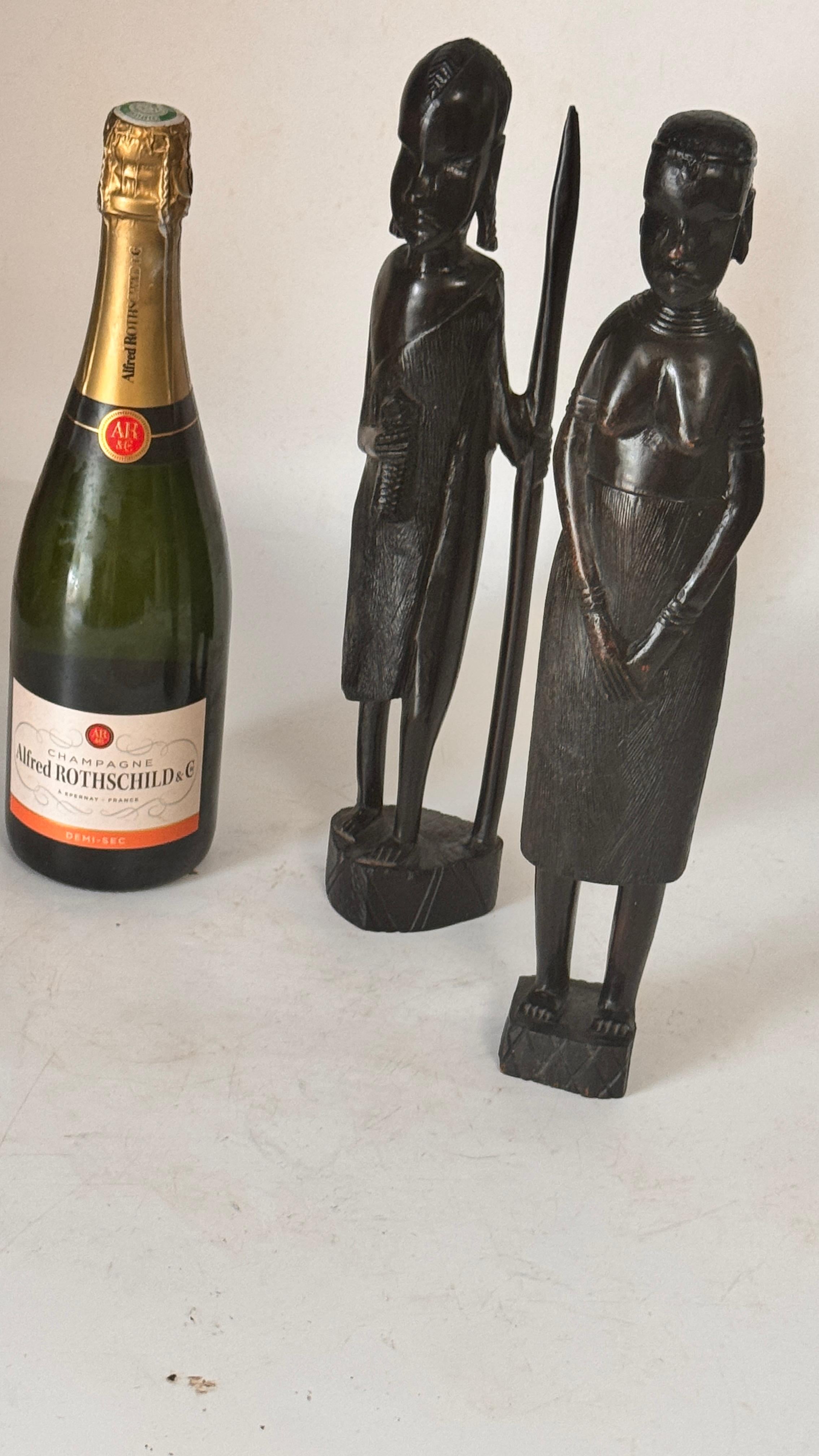 Pair of African Sculptures — Heavy Hardwood, Primitivist Style

Description:
This is a pair of African sculptures carved from exceptionally heavy, high-quality hardwood, displaying remarkable craftsmanship and presence.
The set features:

A man