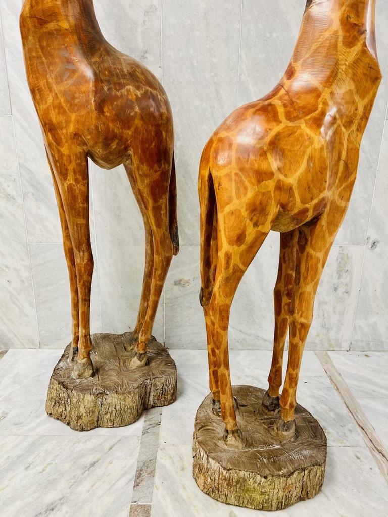 Wood Natural size pair of african sculptures in noble wood representing giraffes  For Sale