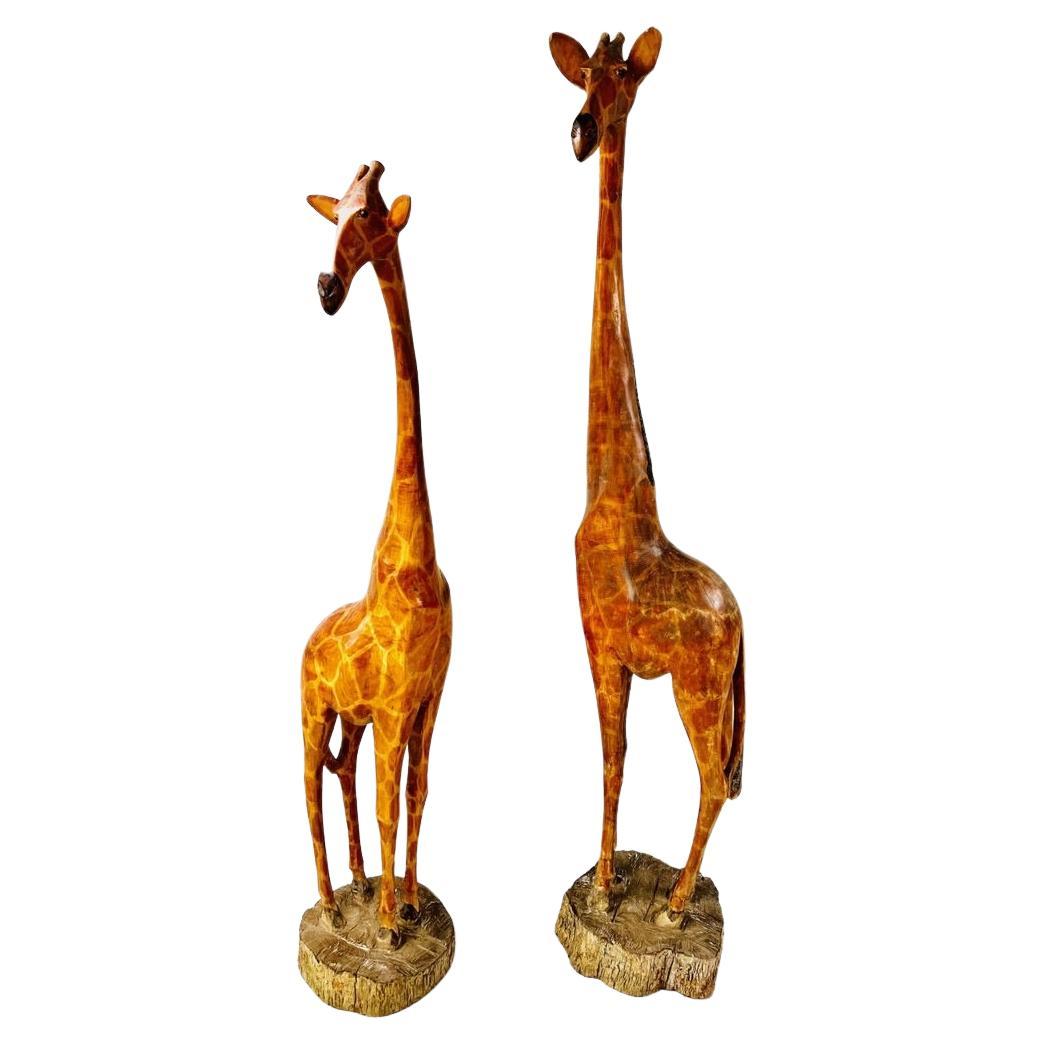 Natural size pair of african sculptures in noble wood representing giraffes  For Sale