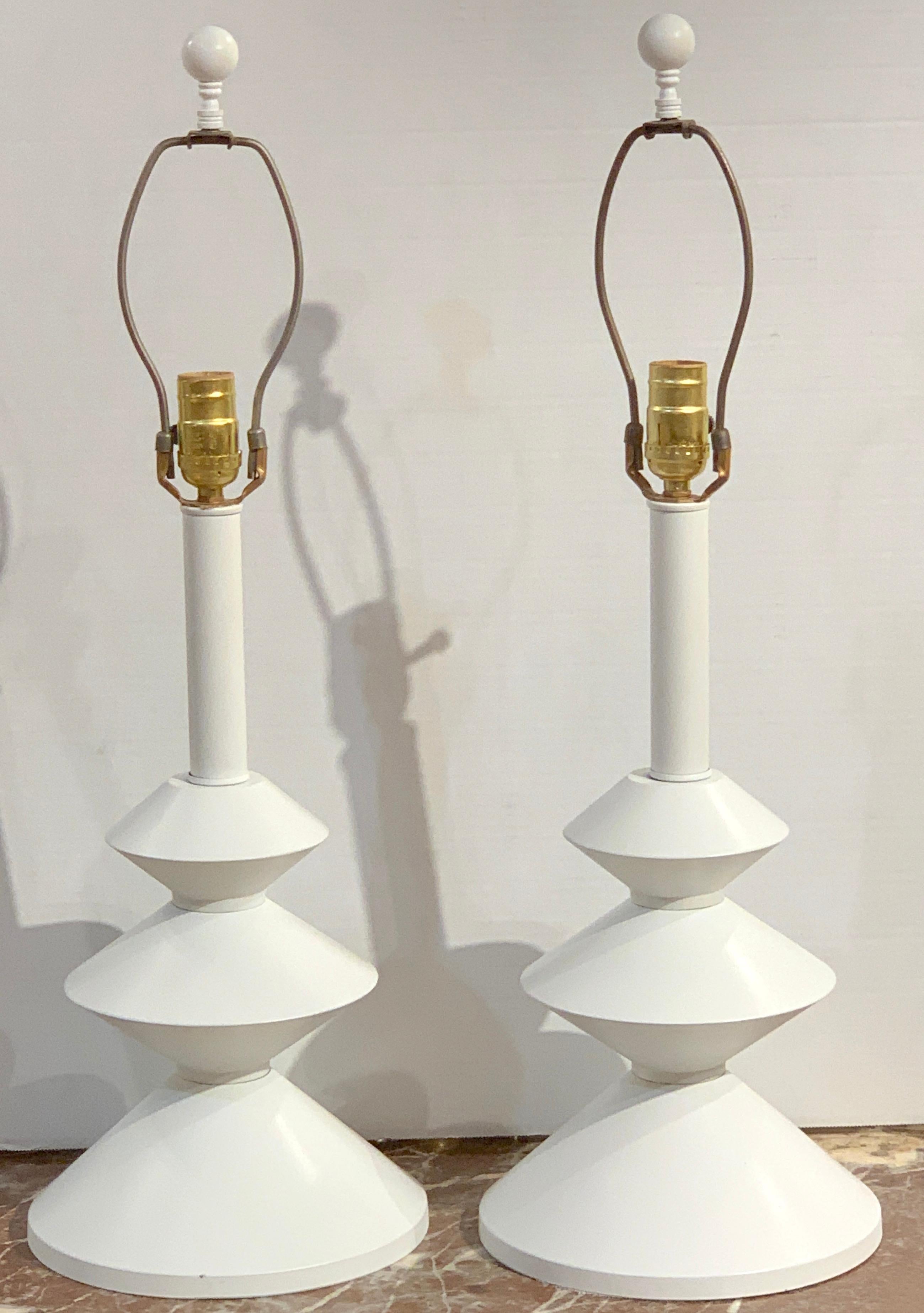 Pair of after, Alberto Giacometti style enameled metal sculptural lamps, a fine vintage pair in enameled metal, the lamps with the harps and finial measure 27-Inches high. The lamps stand 20-Inches high to the top of the socket, 17-inches high to
