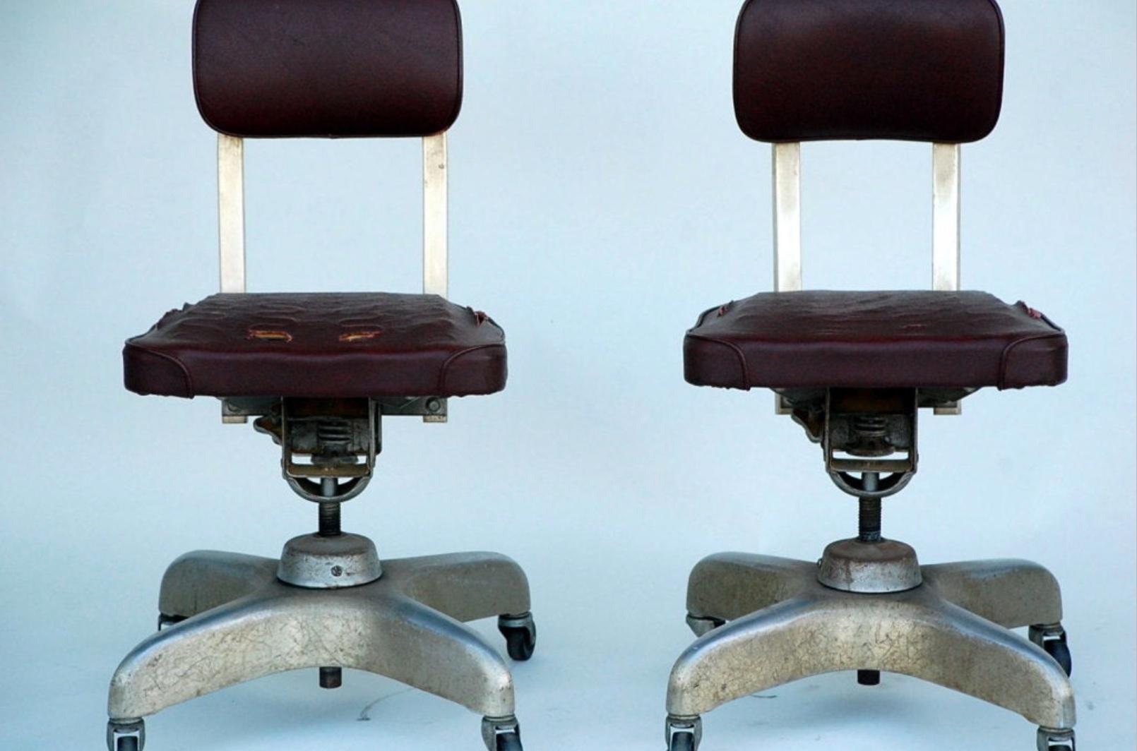 American Pair of Aged Industrial Office Swivel Chairs For Sale