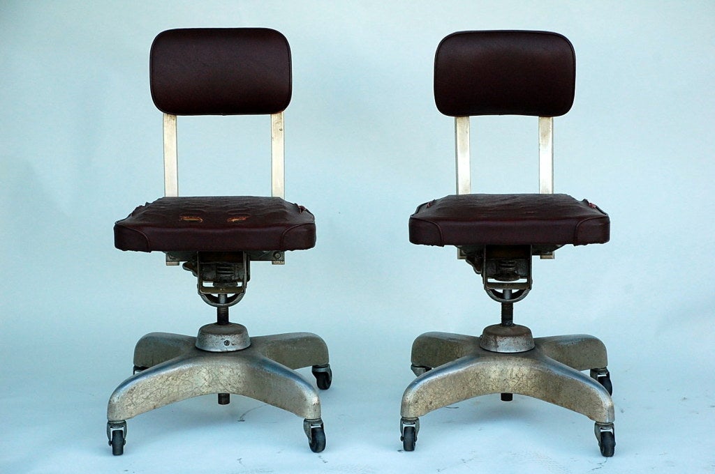American Pair of Aged Industrial Office Swivel Chairs For Sale